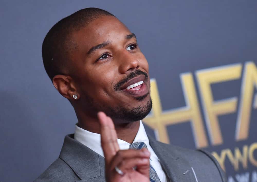 Michael B. Jordan in a grey suit
