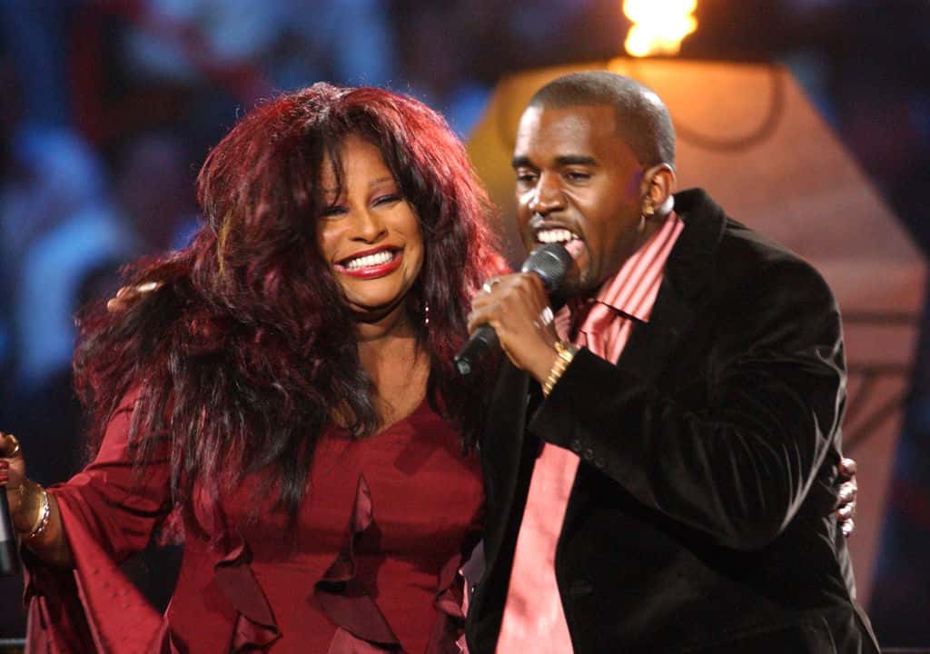Chaka Khan smiling and Kanye West singing on the microphone
