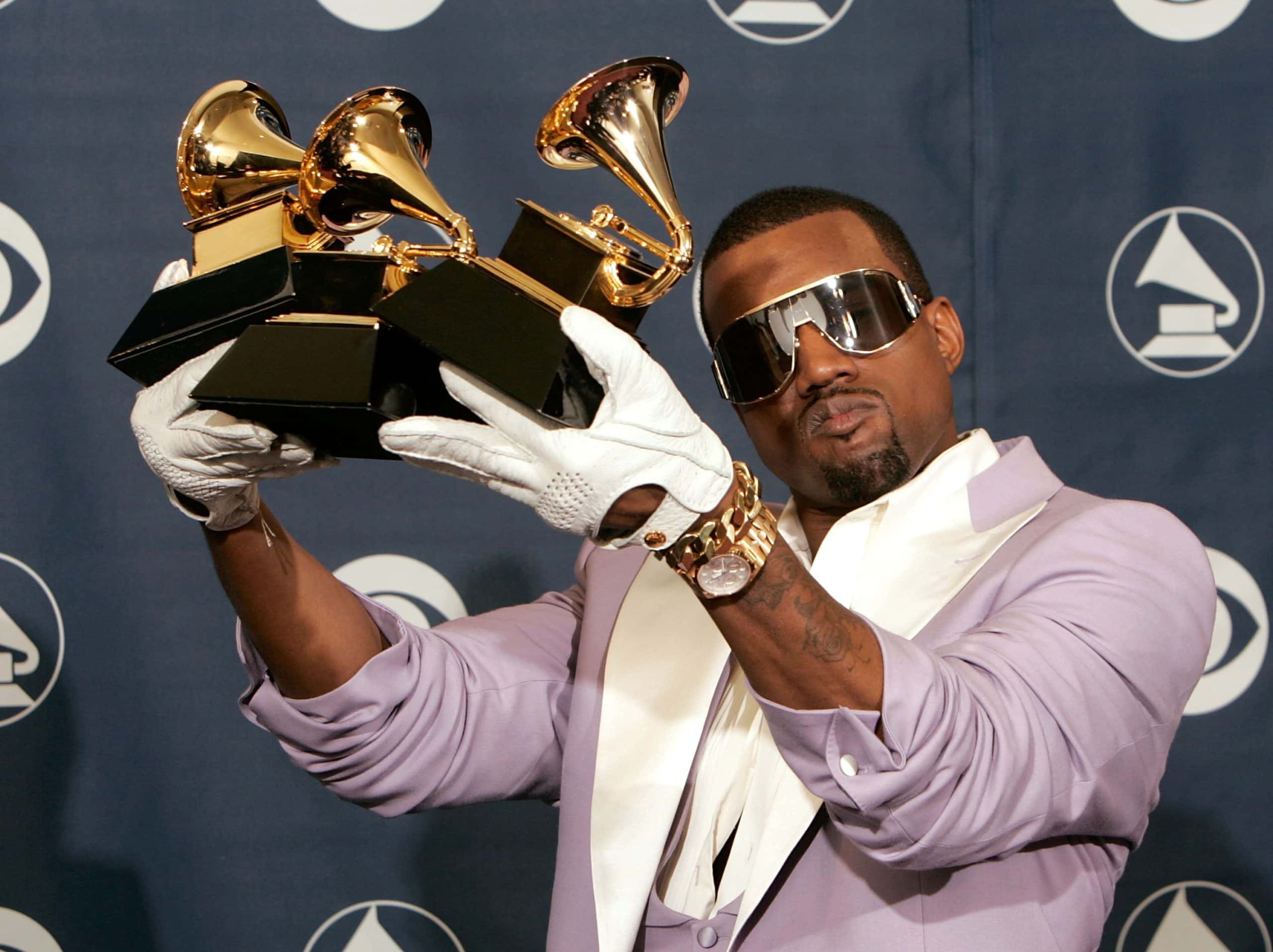 Singer Kanye West poses with his Best Rap Song