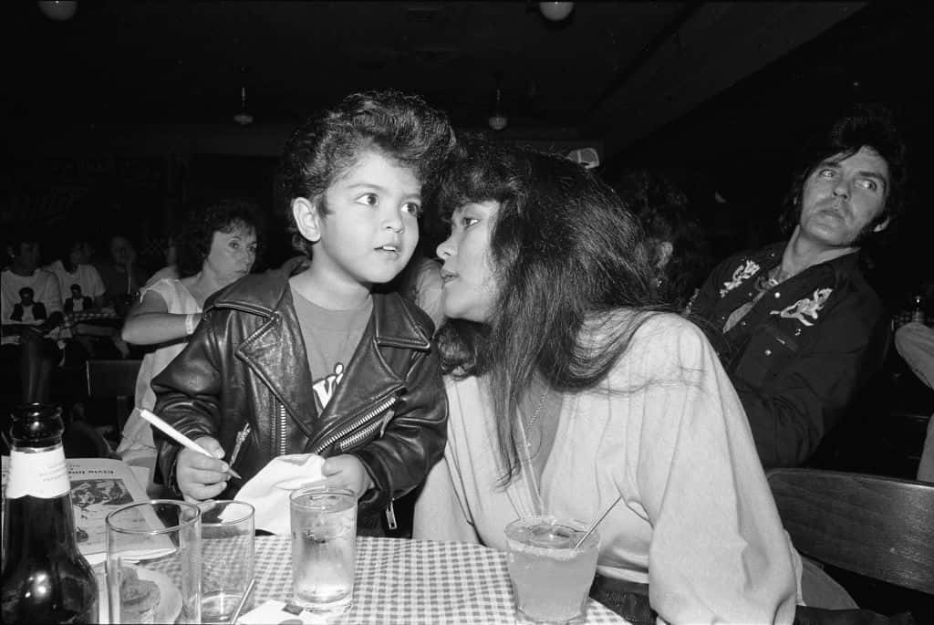 American singer-songwriter and music producer Bruno Mars (born Peter Hernandez), left, shown here as a four year old Elvis impersonator
