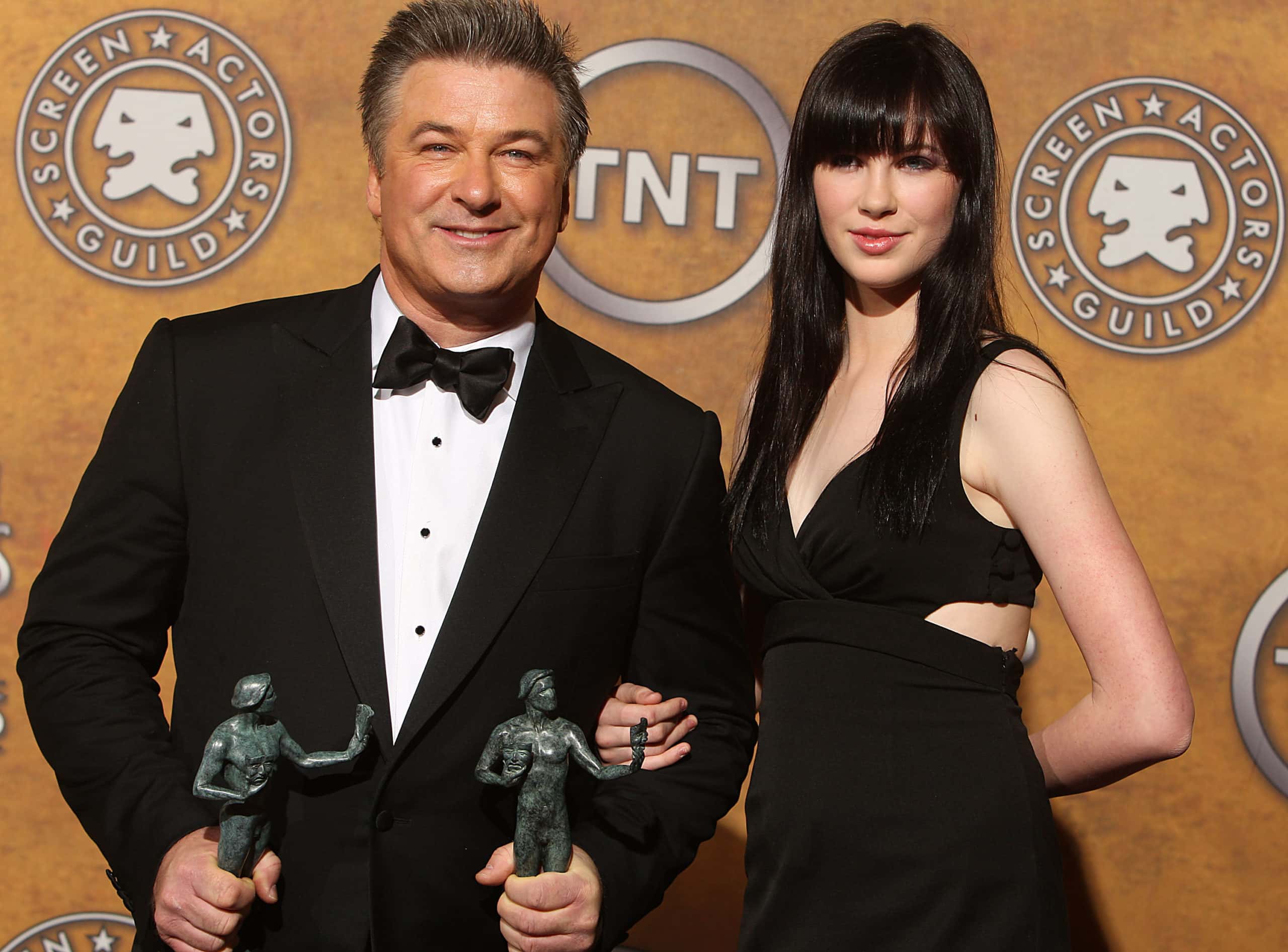 Actor Alec Baldwin (L) and his daughter Ireland pose with his award