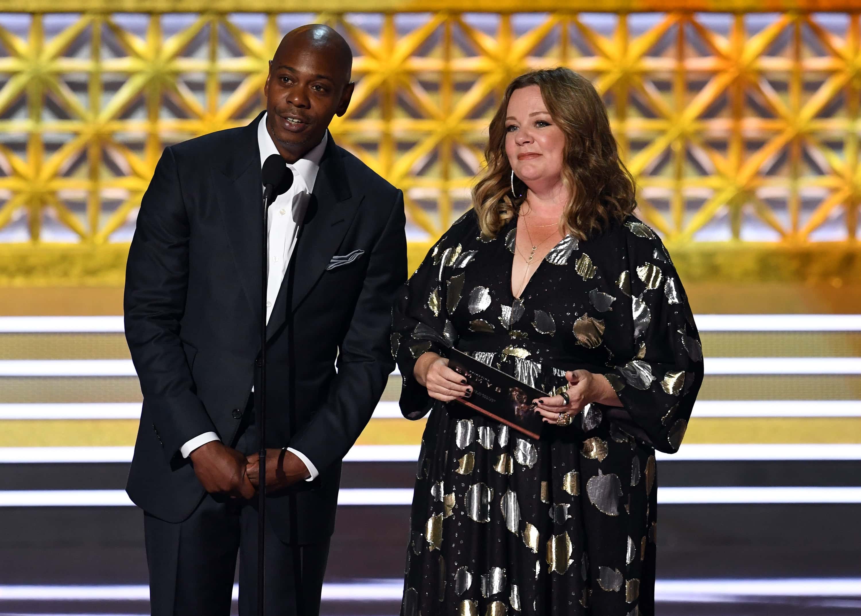 Comedian Dave Chappelle and actor Melissa McCarthy speak onstage