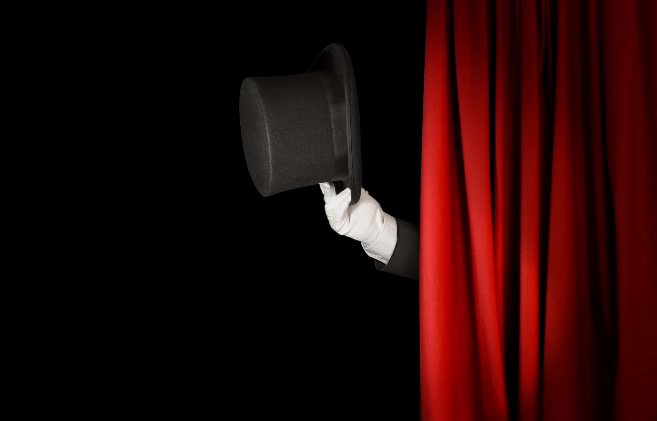 Magician holding top hat