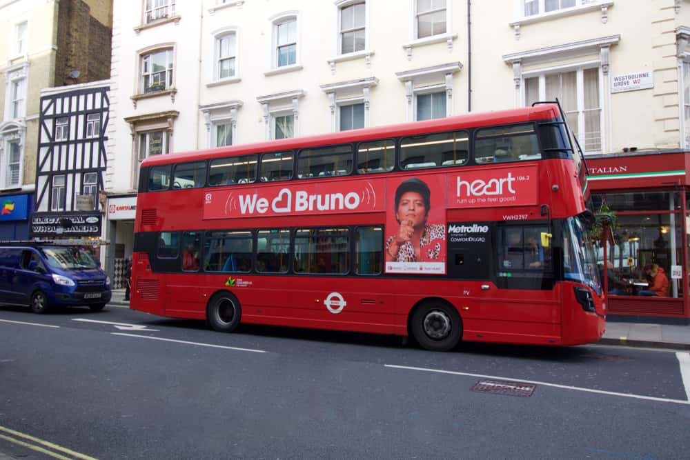 Red London Bus With Advertisement Promoting Bruno Mars