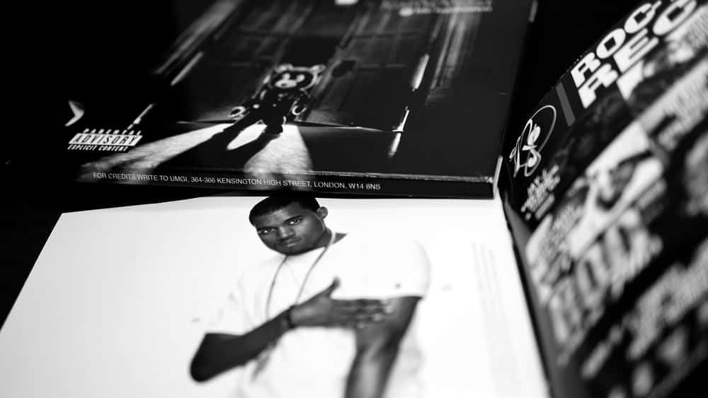 Detail of CDs and artwork of musician Kanye West