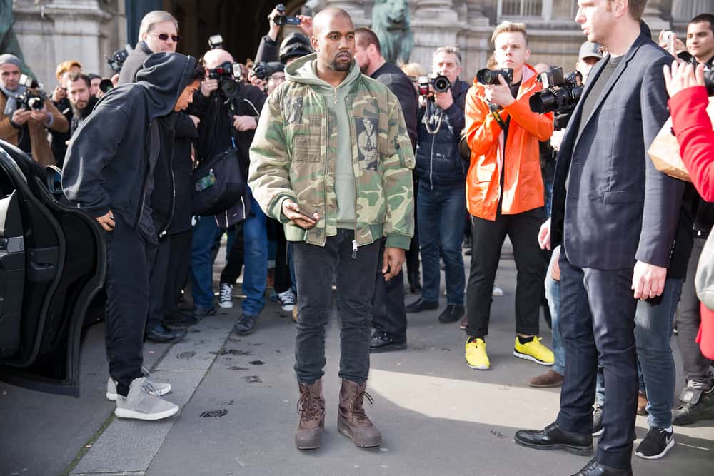 Kanye West in a green army jacket