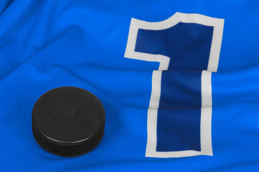 Washer and blue hockey jersey with the number one