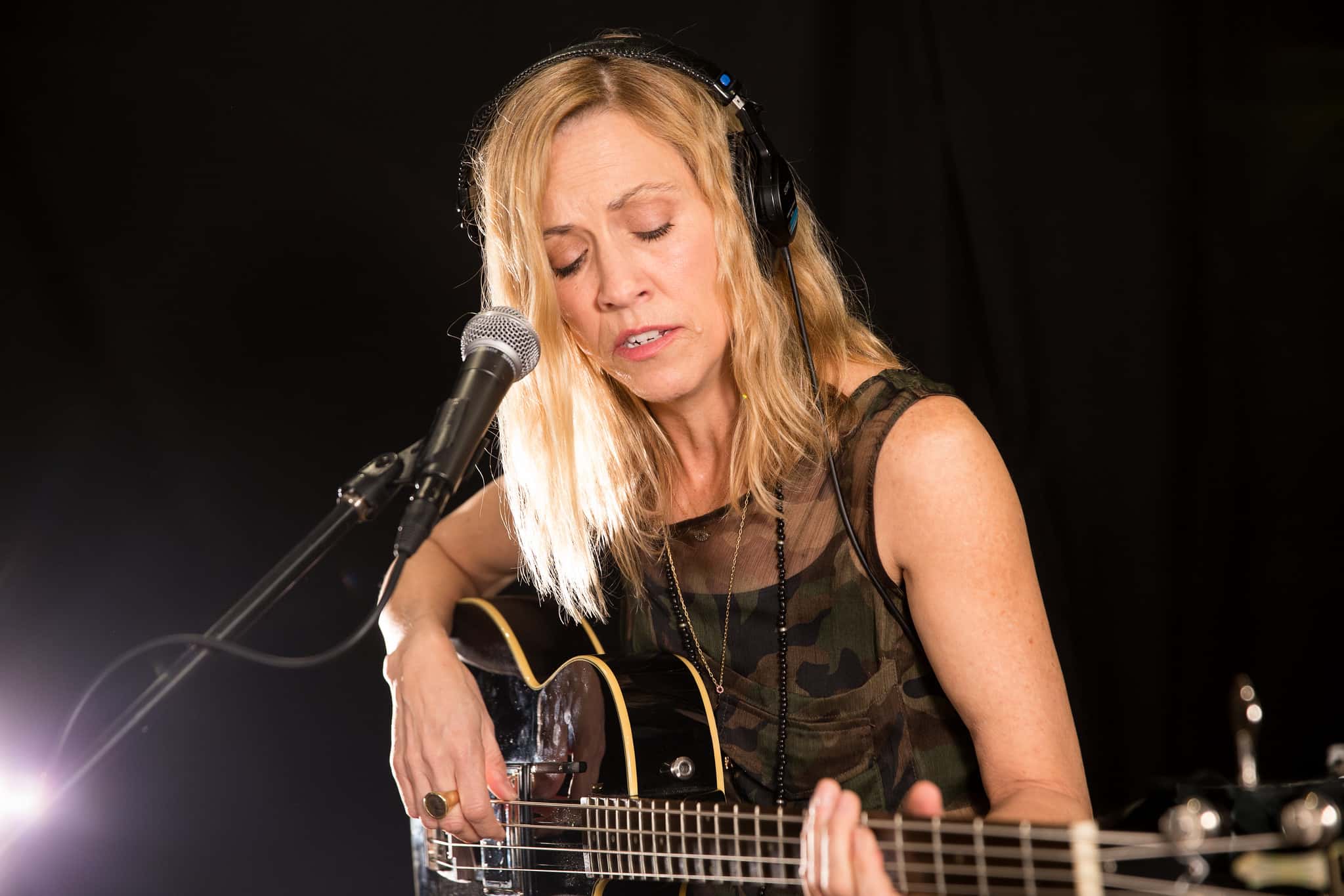 Sheryl Crow playing guitar