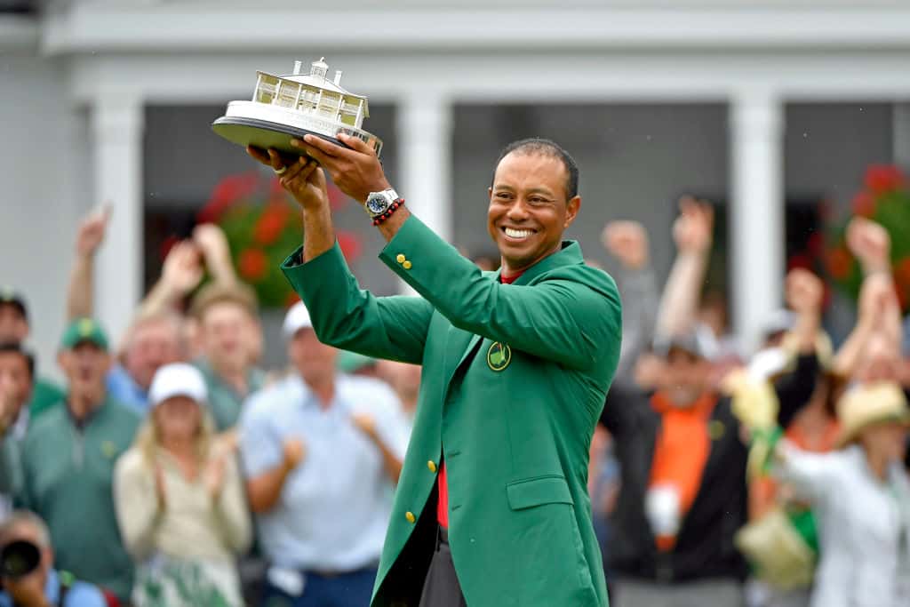 Masters champion Tiger Woods holds up the trophy during the Green Jacket Ceremony