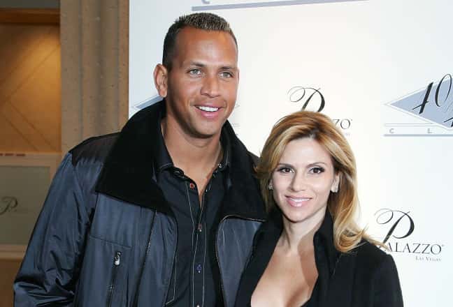 Alex Rodriguez (L) of the New York Yankees and his wife Cynthia Scurtis