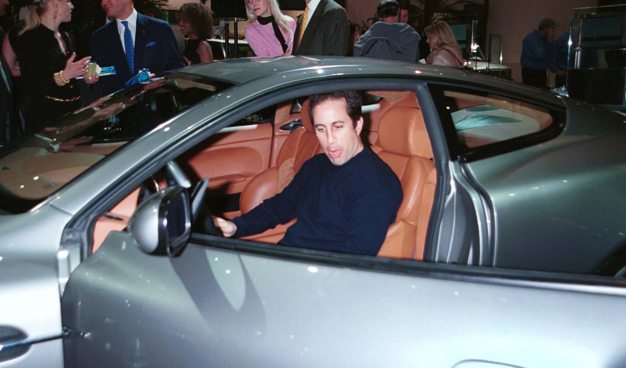 Actor and comedian Jerry Seinfeld checks out the new Aston Martin V12 Vanquish