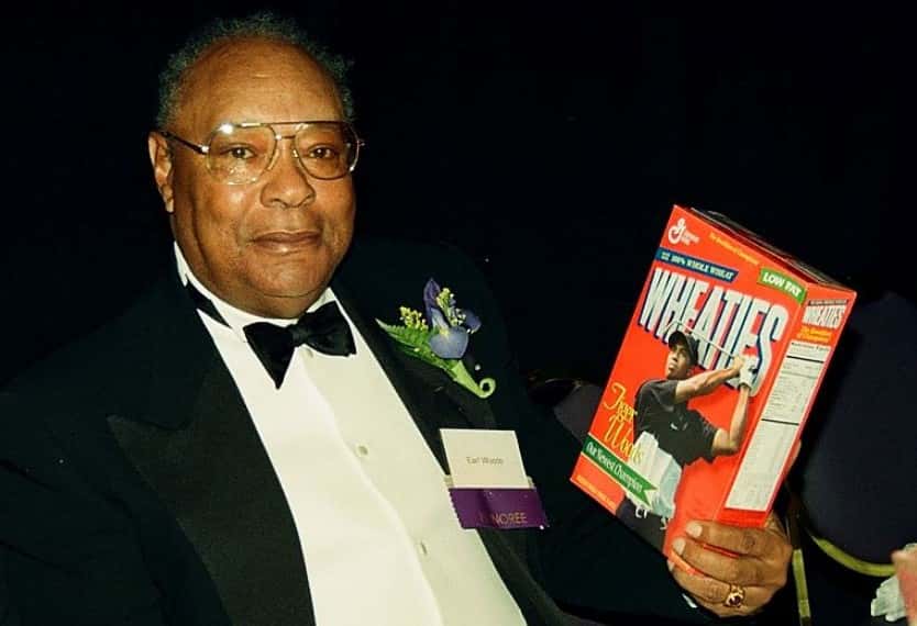 Earl Woods wearing a black suit