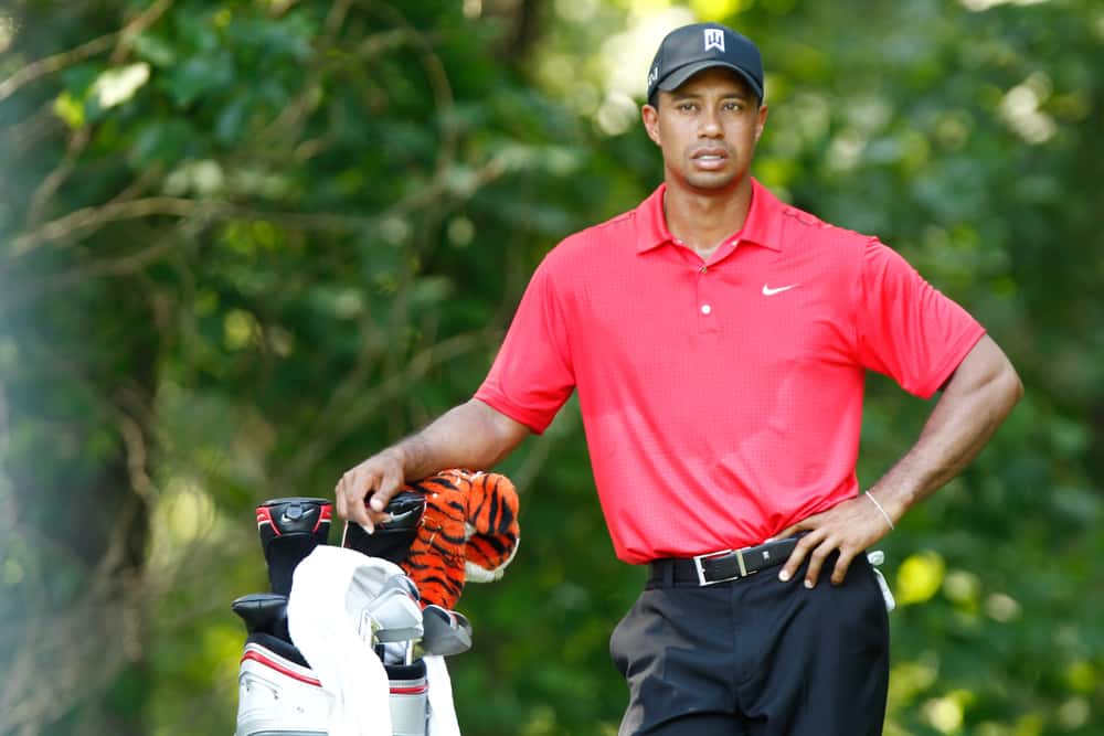 Tiger Woods waits to tee off on the 13th hole