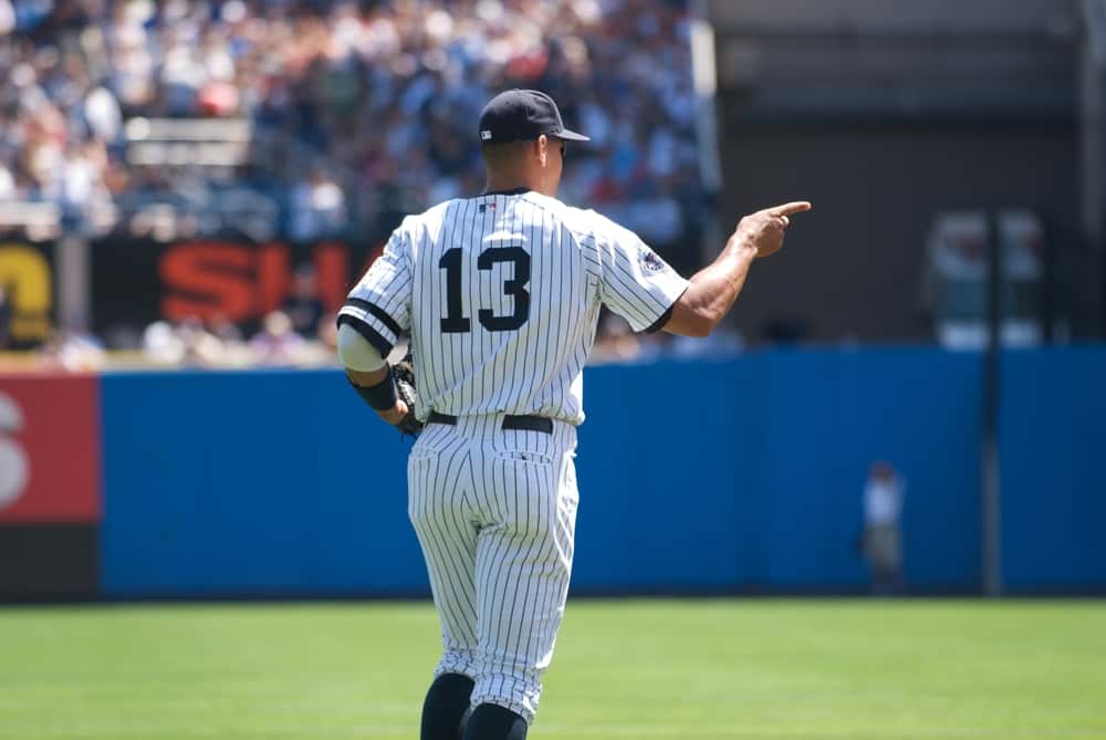 Alex Rodriguez runs on to the field at a game at Yankee Stadium