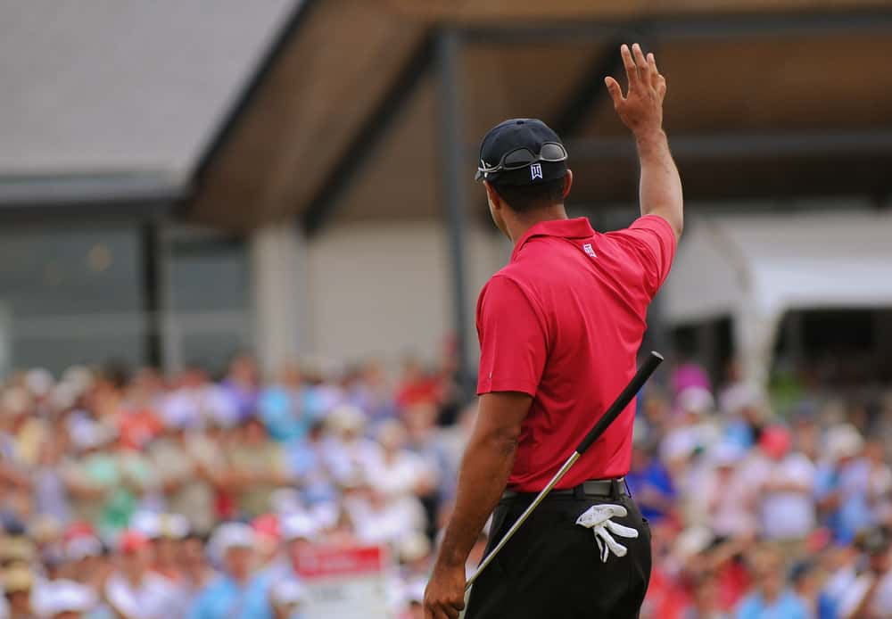American golfer Tiger Woods waves goodbye to the crowd