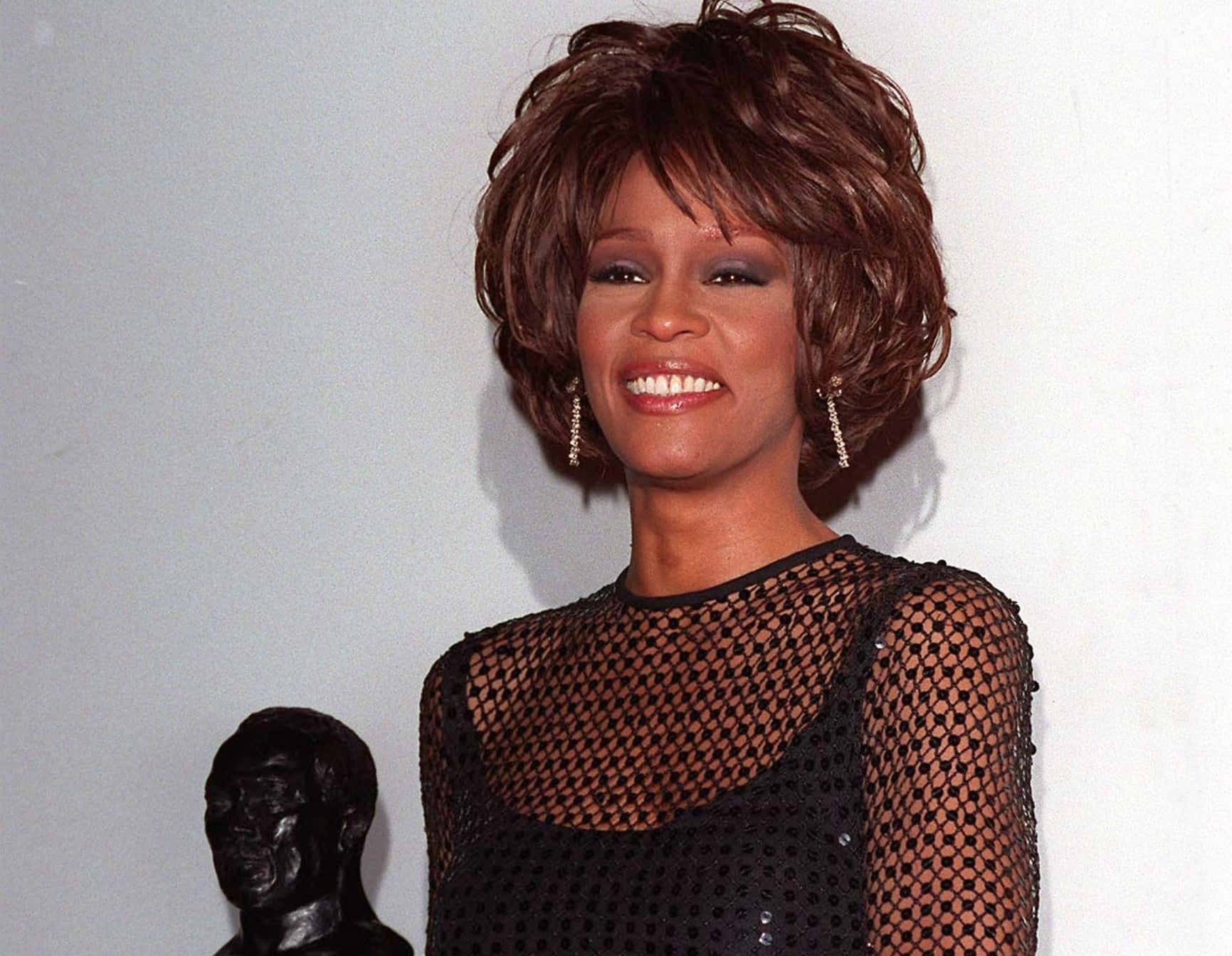 Whitney Houston at the Soul Train Awards in black transparent shirt - 1998