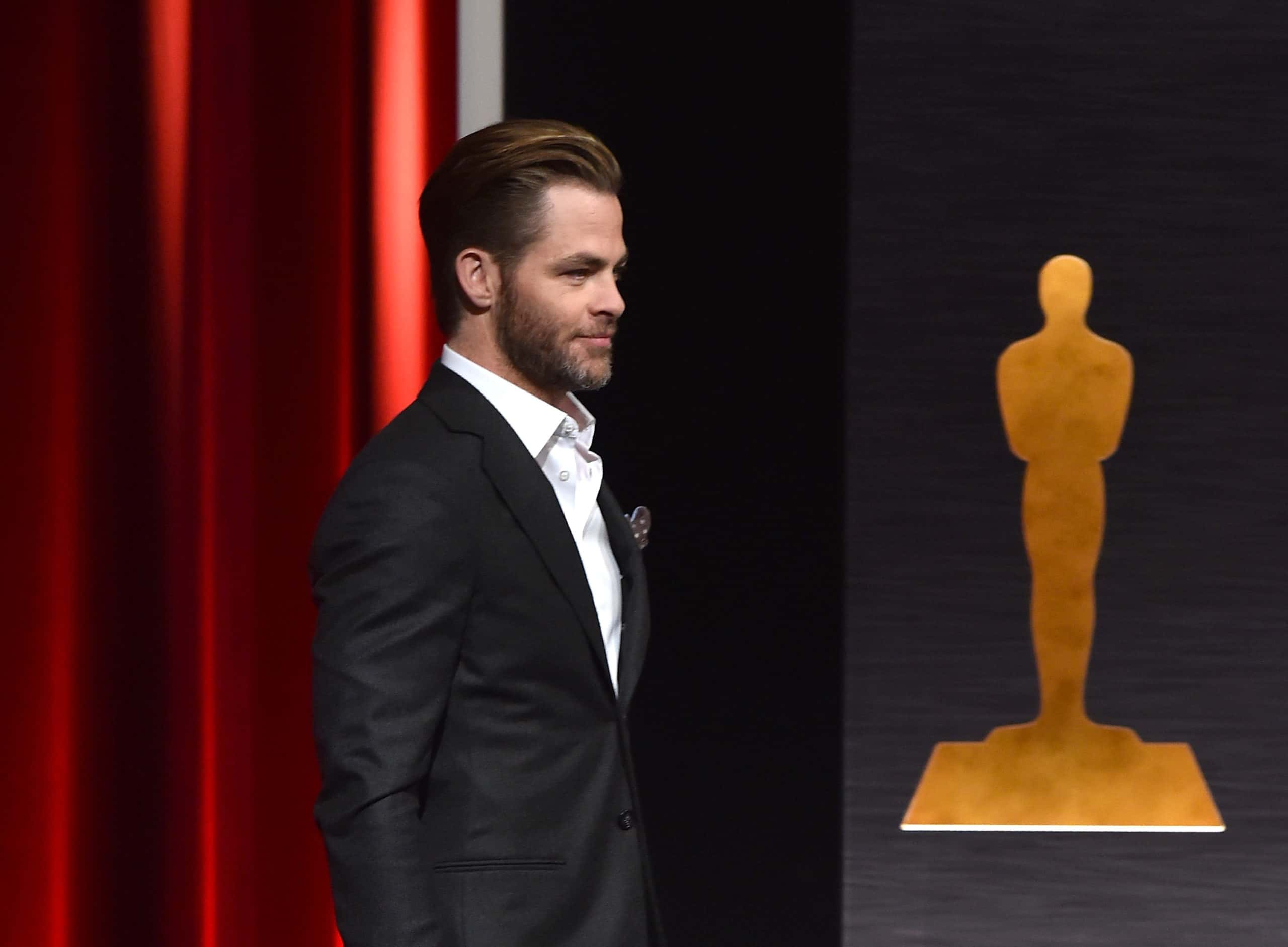 Actor Chris Pine walks to the podium to announce the nominees for the 87th Academy Awards Nominations Announcement