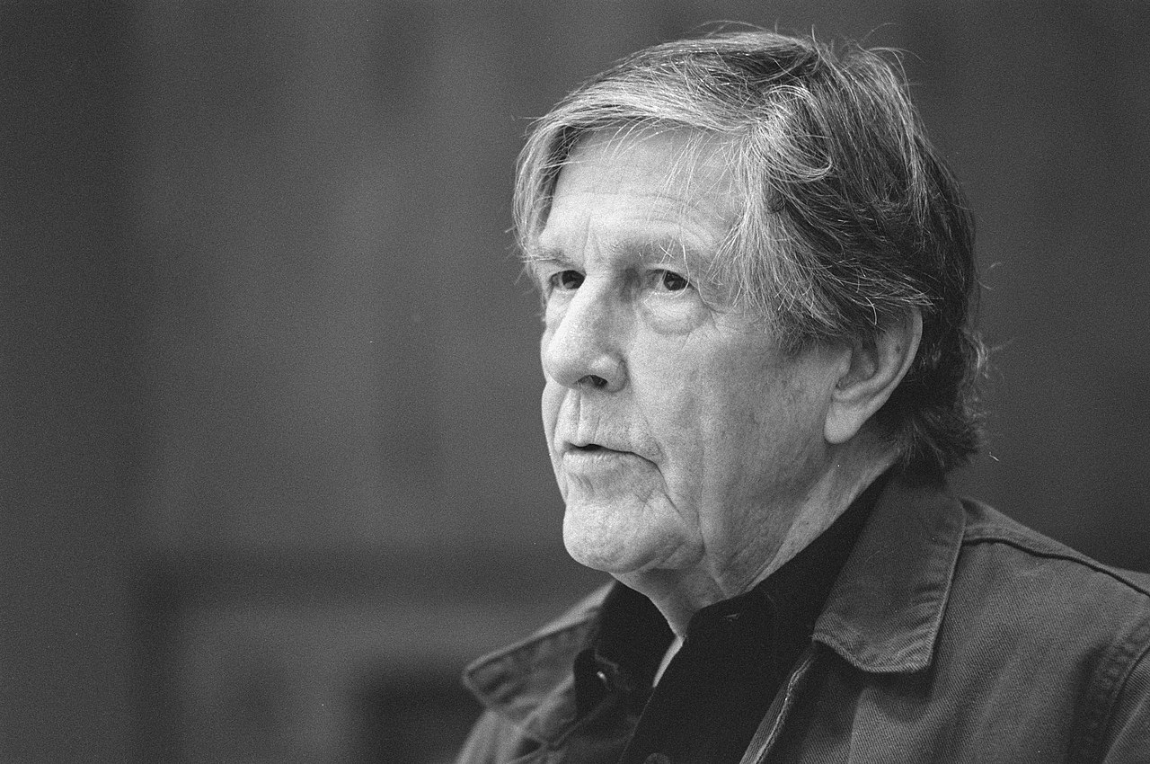 Grayscale Portrait Photo of John Cage wearing jacket