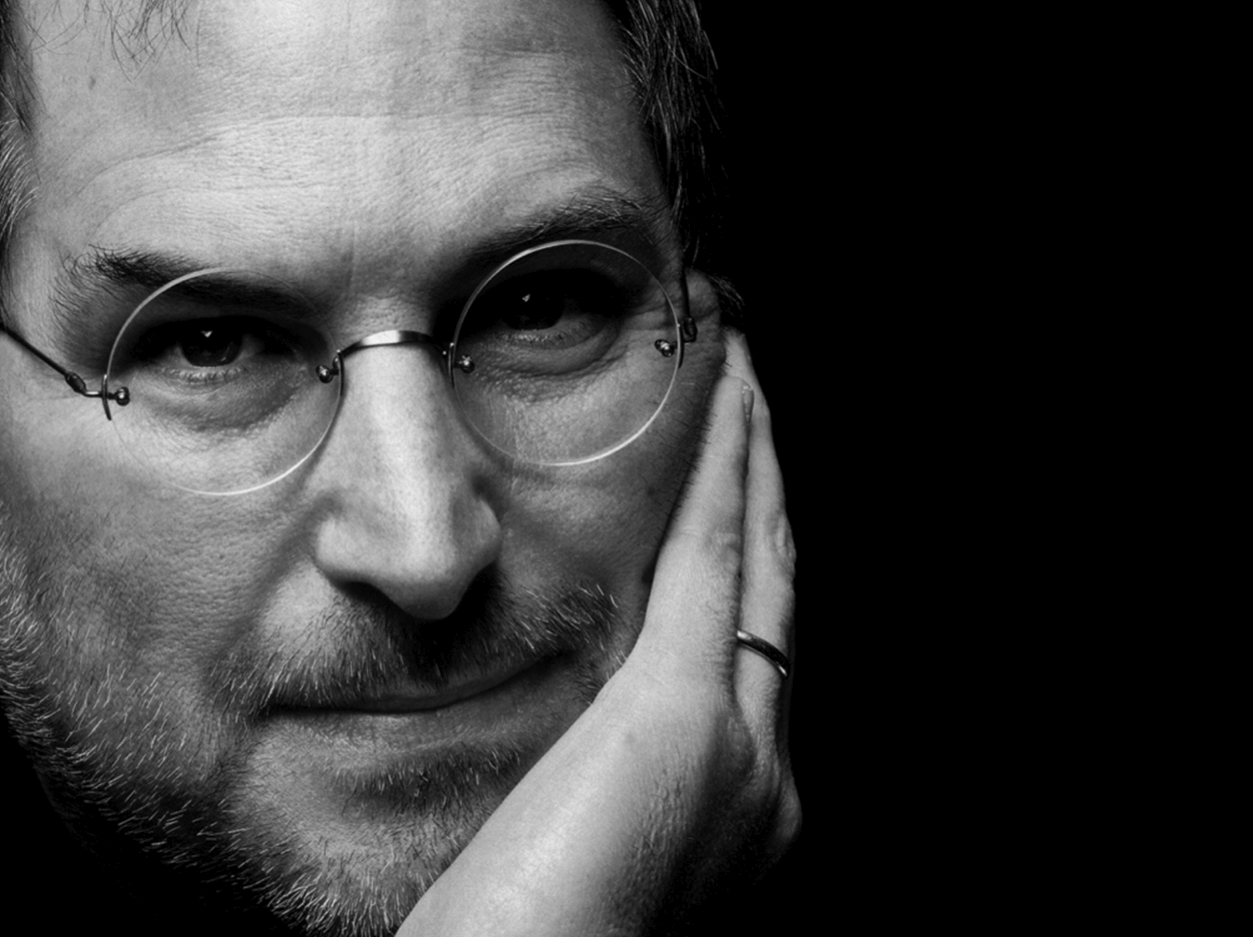 Grayscale Portrait Photo of Steve Jobs with glasses