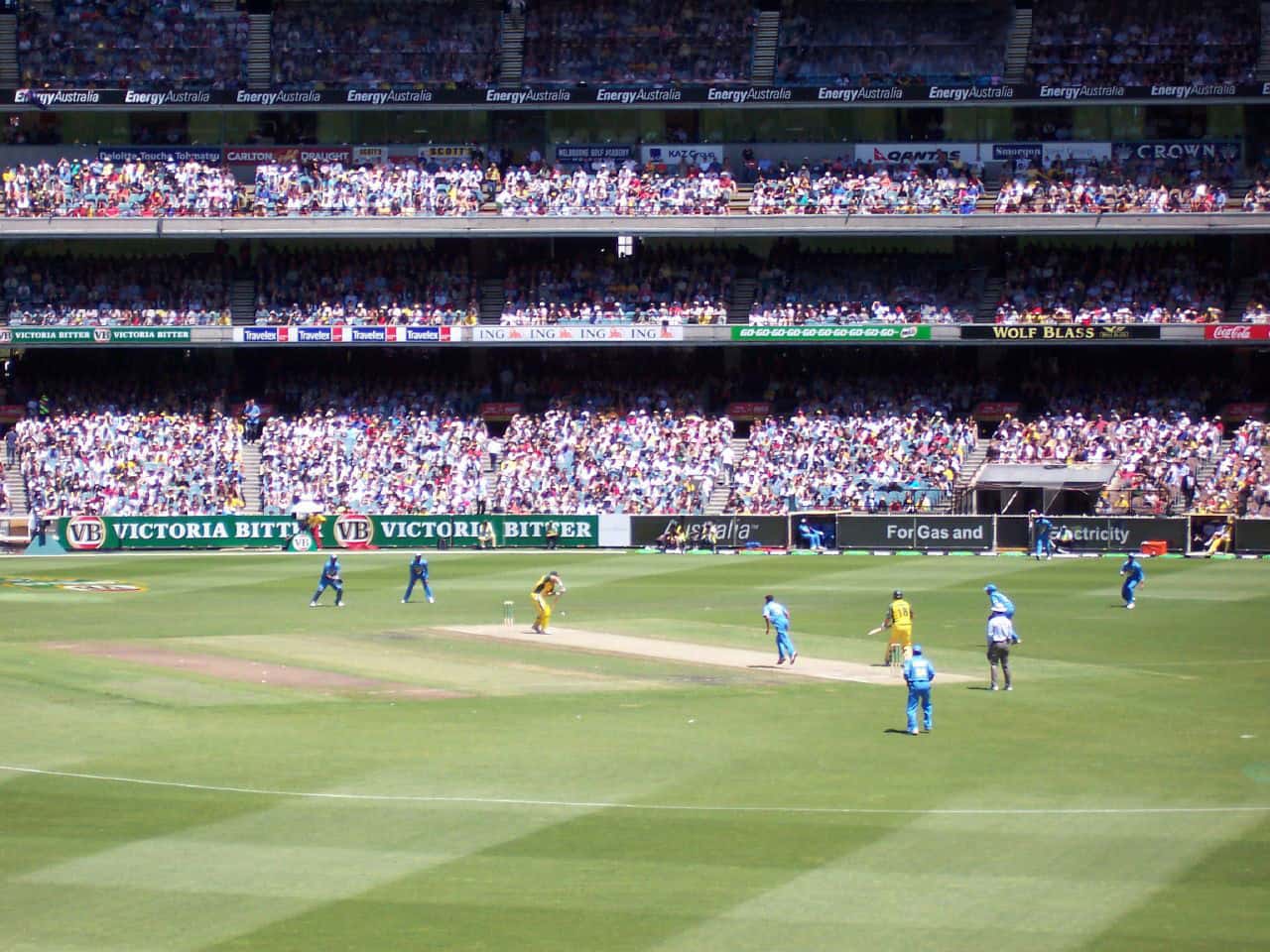 Advertisement promoting the Australian cricket team, heavily featuring sponsor logos.