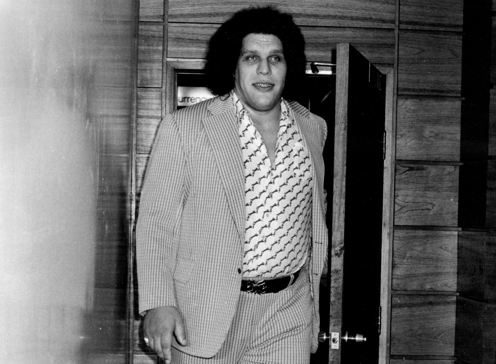 Andre the Giant walking through door
