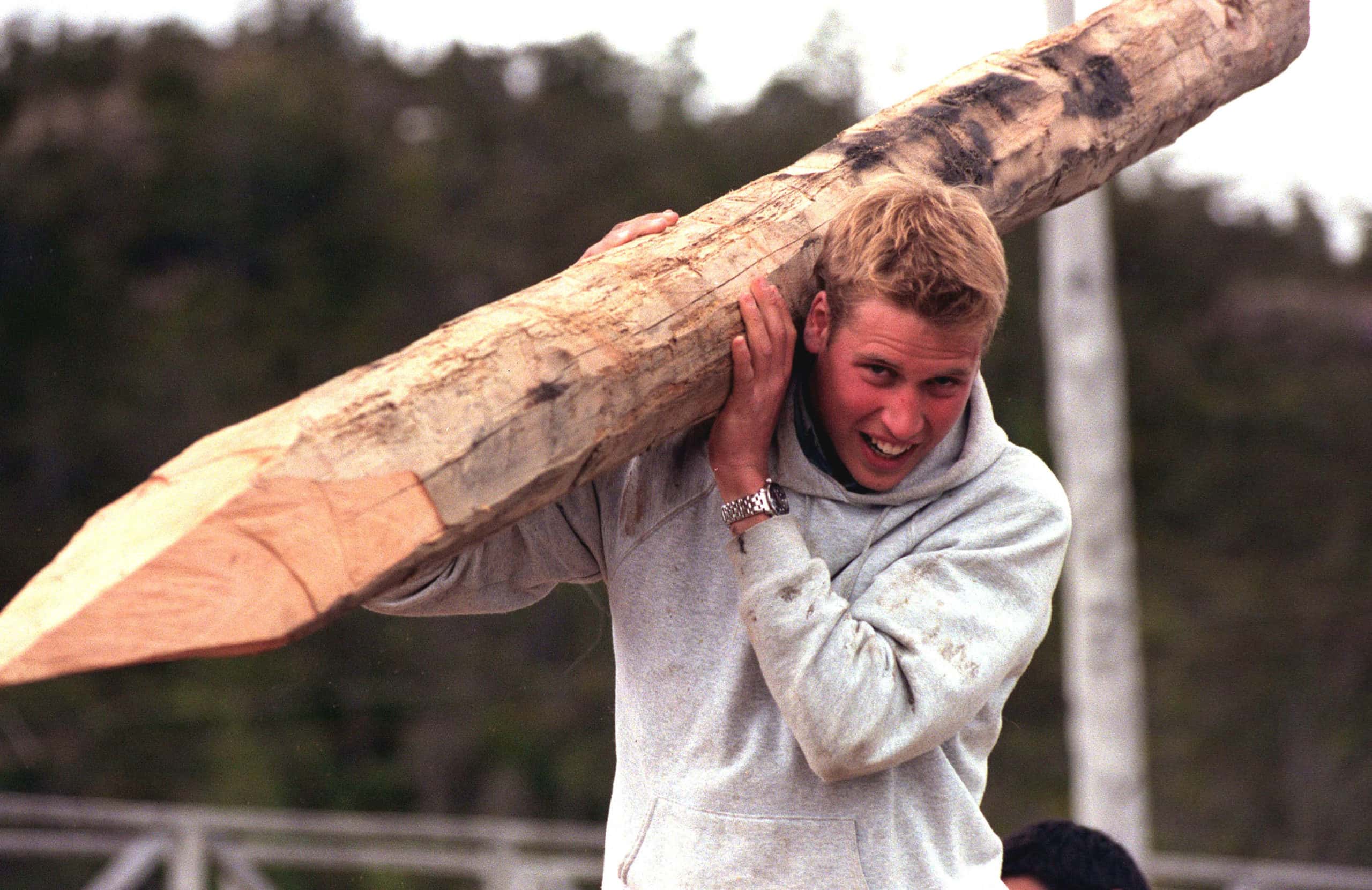 Prince William carries a log
