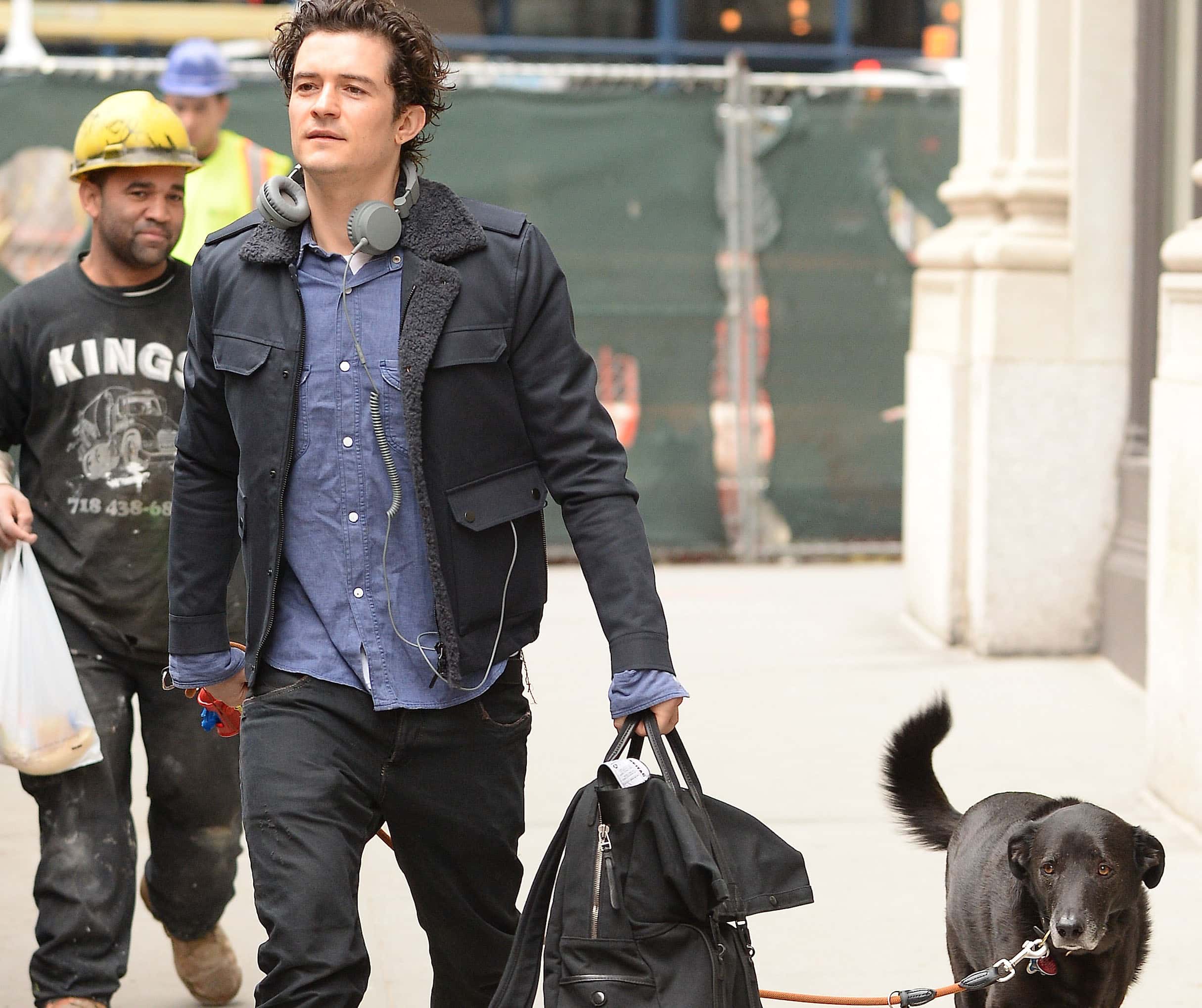 Actor Orlando Bloom walking his dog