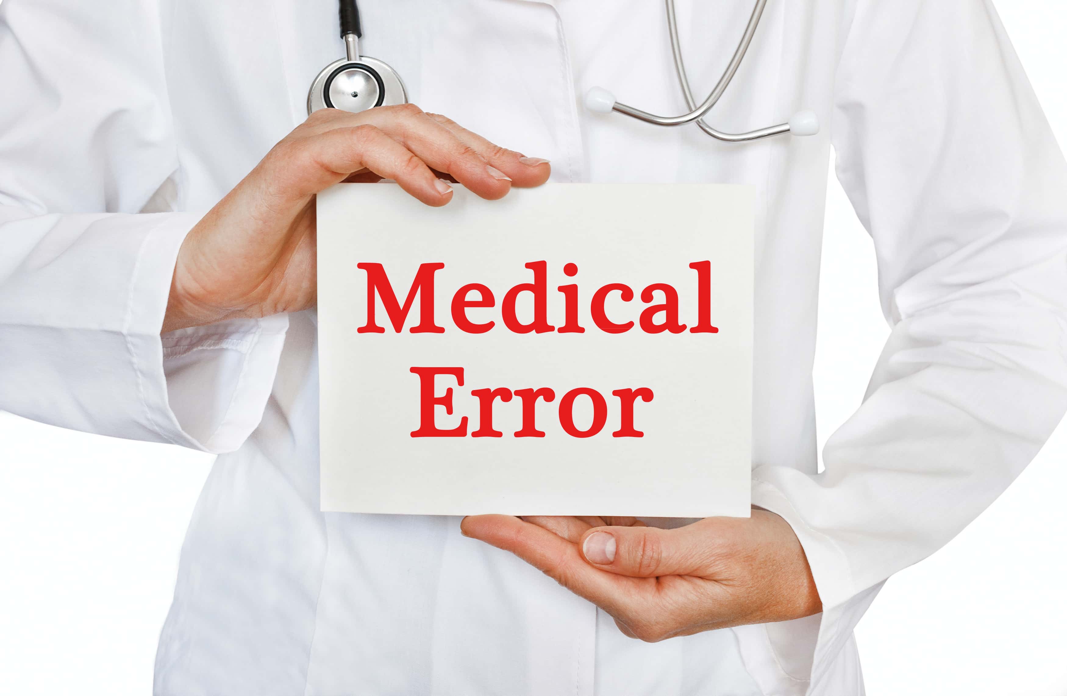 Doctor holding a board with Medical Error