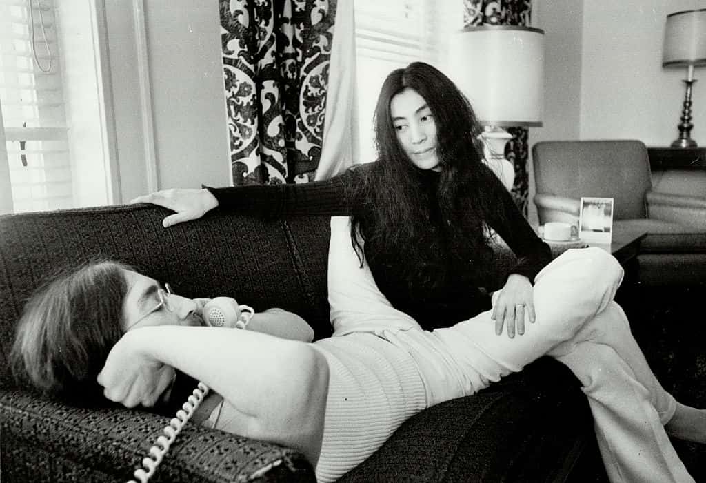 John Lennon and Yoko Ono on a couch