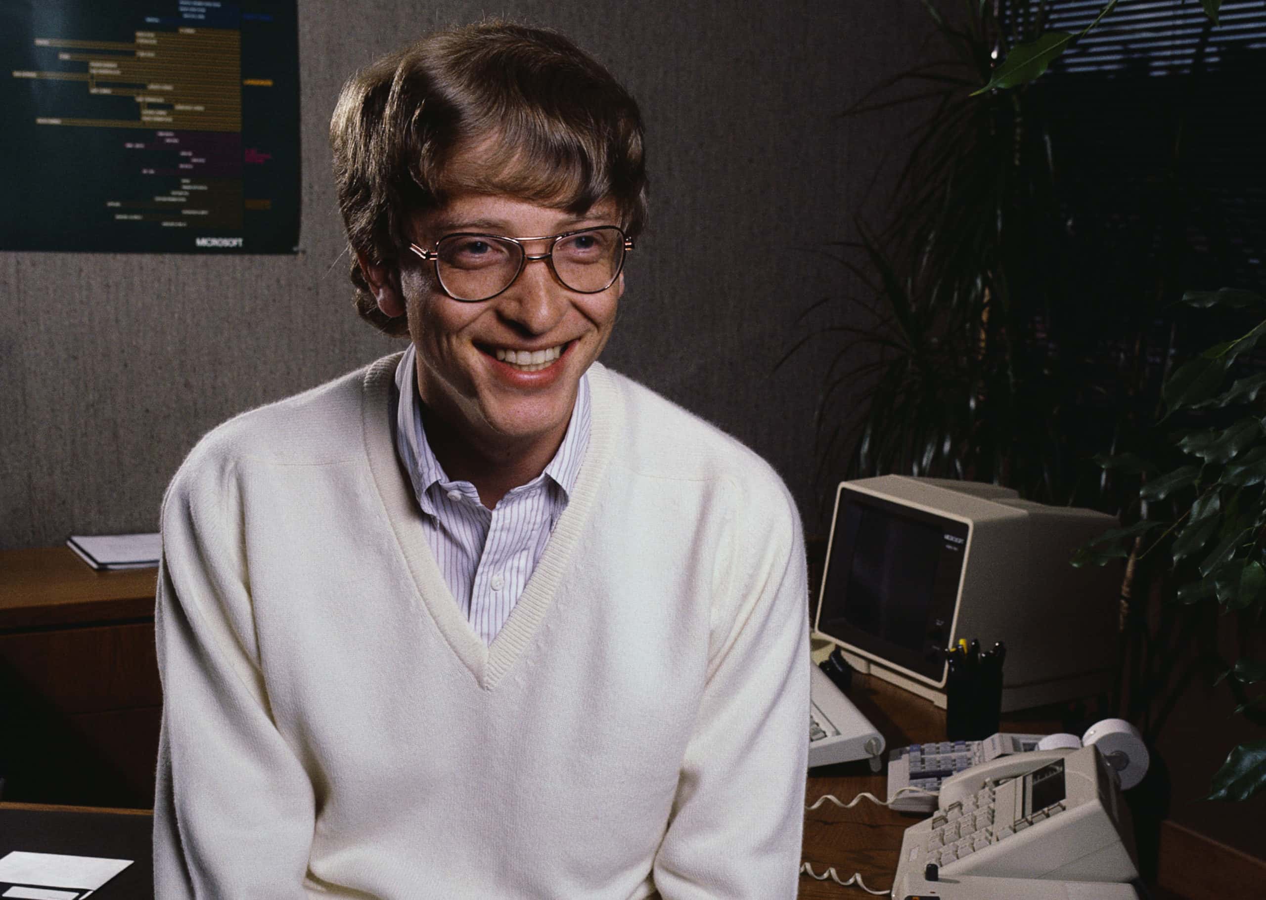 Portrait Photo of Microsoft CEO Bill Gates in white outfit