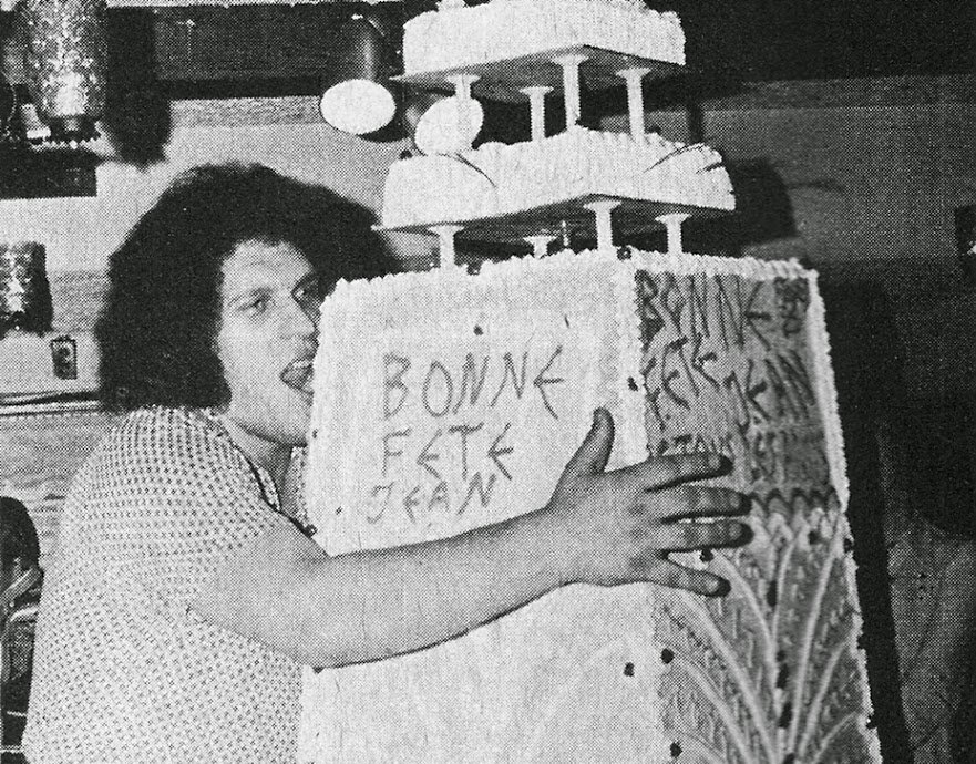 Andre the Giant and his birthday cake taller than him 