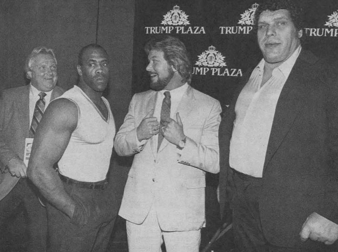 Andre the Giant looking at the camera much taller than other wrestlers 
