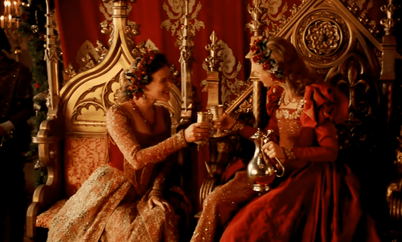 Screenshot of Catherine Howard with long hair wearing red dress is talking - from The Tudors (2007–2010)