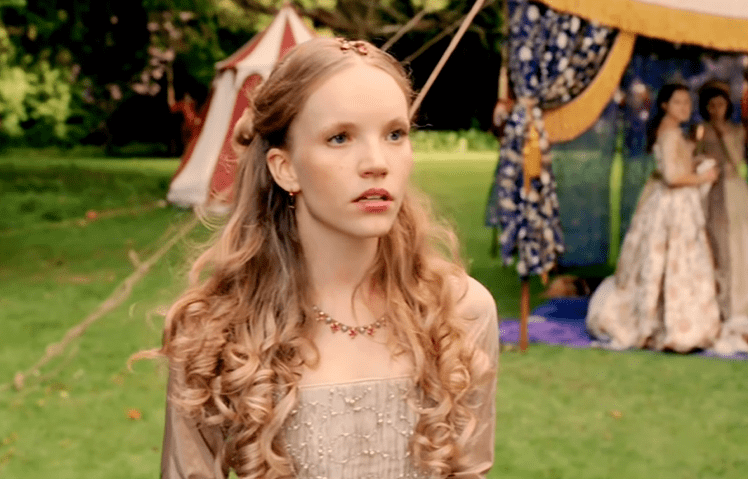 Screenshot of Catherine Howard with long hair looking upset outside - from The Tudors (2007–2010)