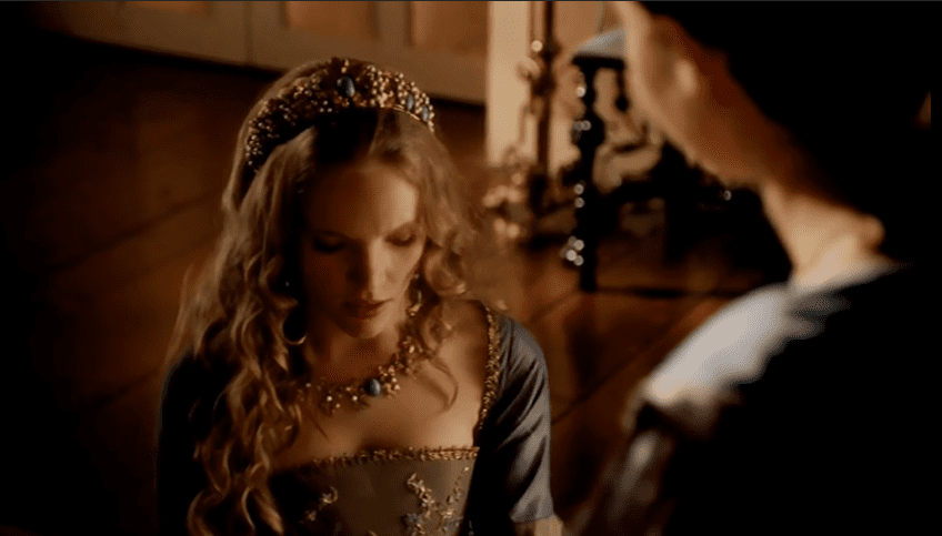 Screenshot of Catherine Howard with long hair wearing crown is looking down - from The Tudors (2007–2010)