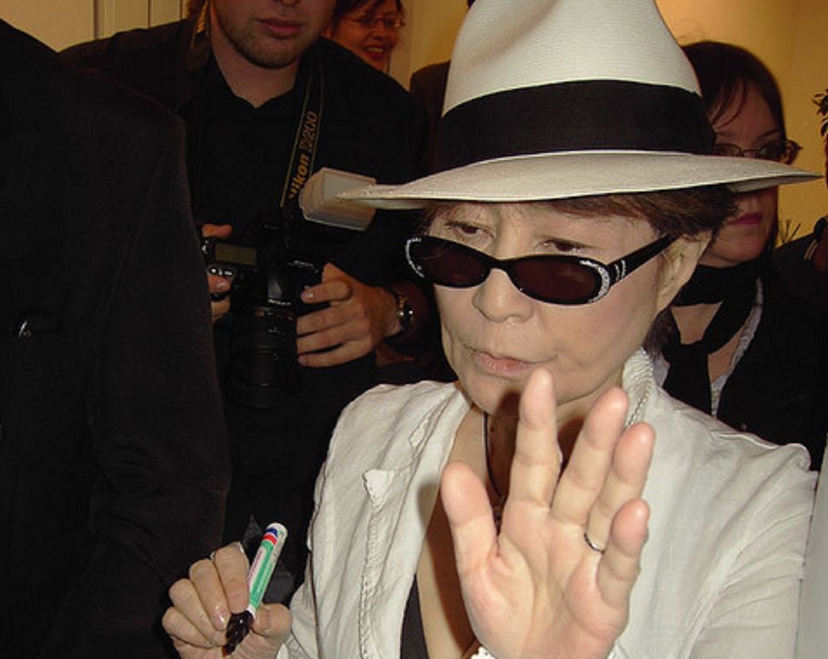 Portrait Photo of Yoko Ono  in white outfit  in Antwerp (Belgium)