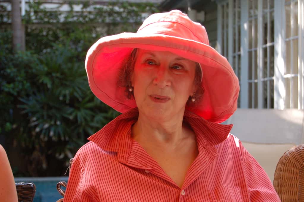 Margaret Atwood wearing red shirt and hat