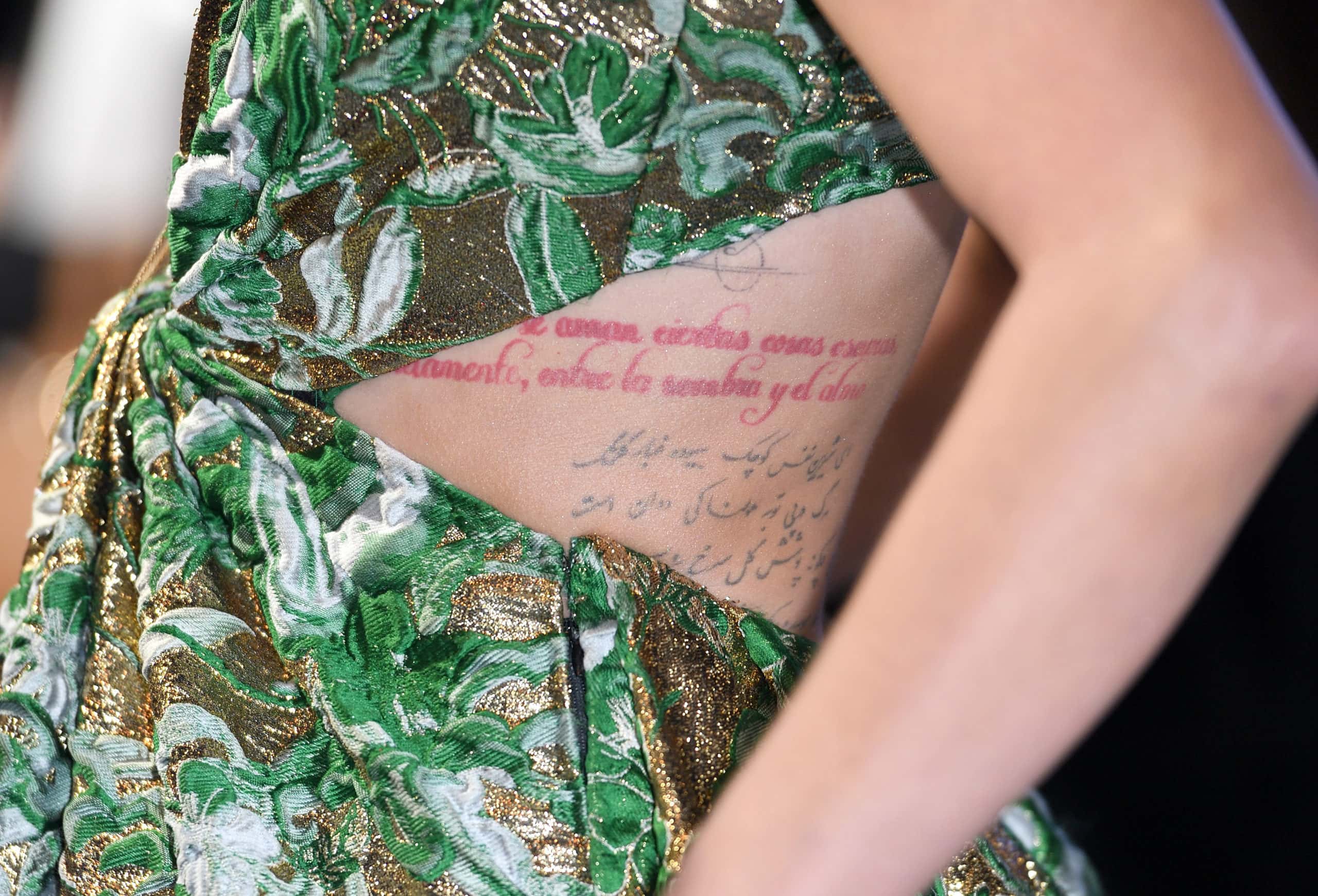 Amber Heard, tattoo detail, attends the World Premiere of "Aquaman" at Cineworld Leicester Square on November 26, 2018