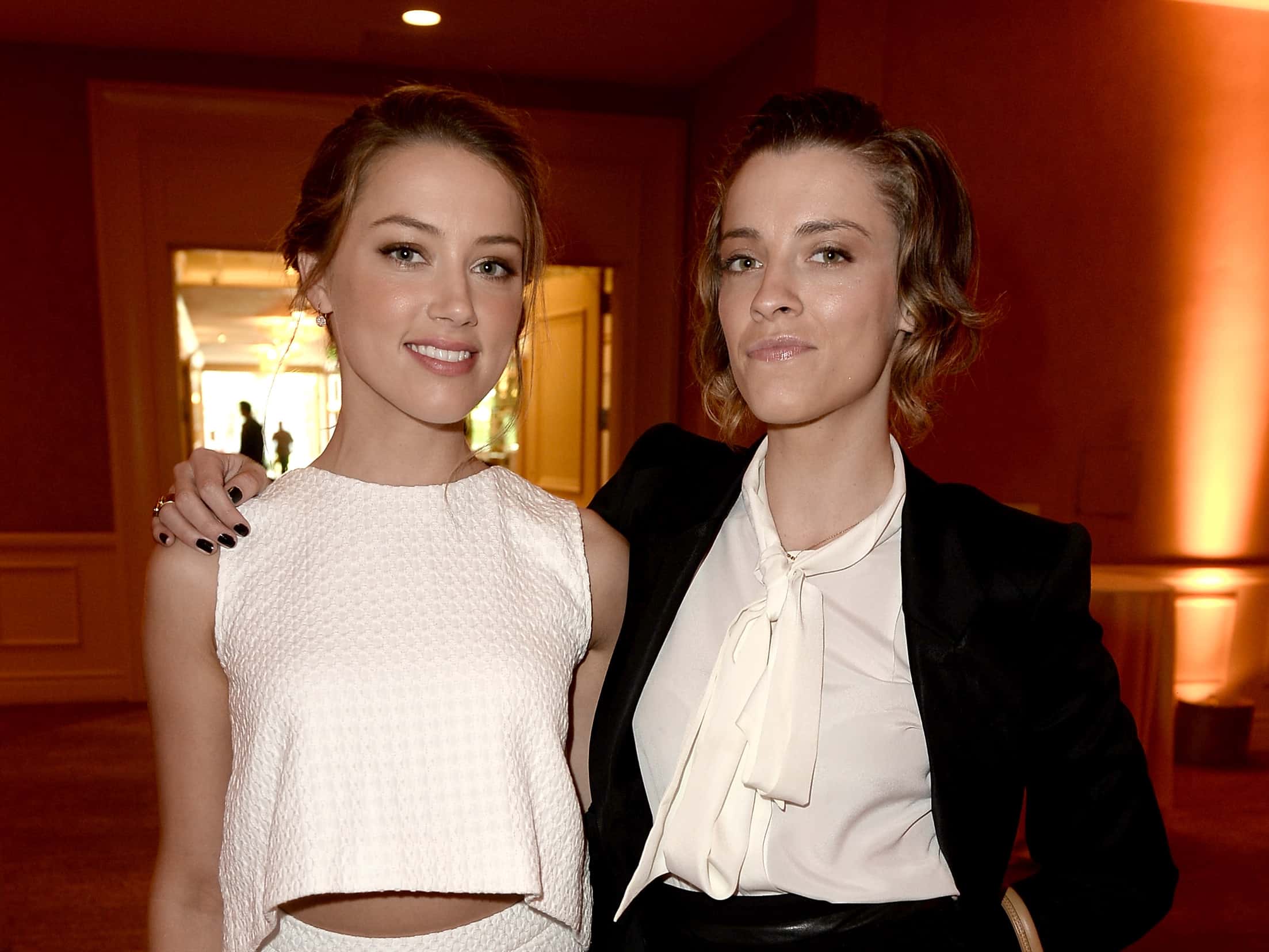 Amber Heard (L) and sister Witney Heard attend the Hollywood Foreign Press Association's 2013 