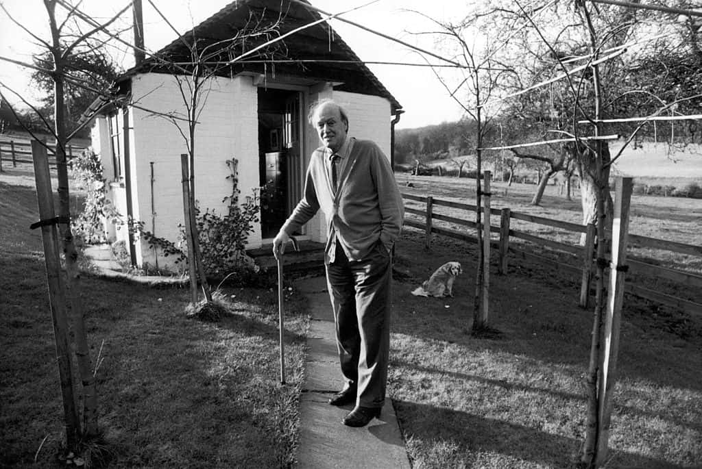 Writer Roald Dahl holds onto his cane