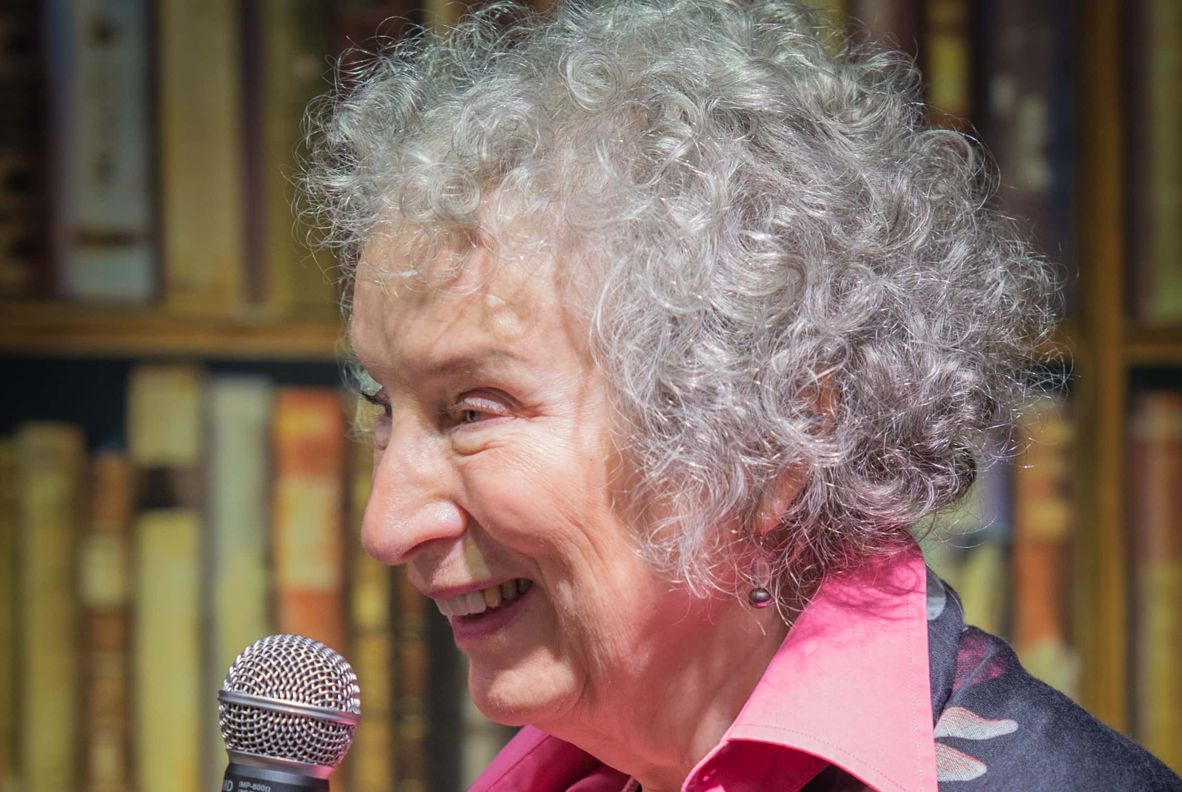Margaret Atwood holding a microphone