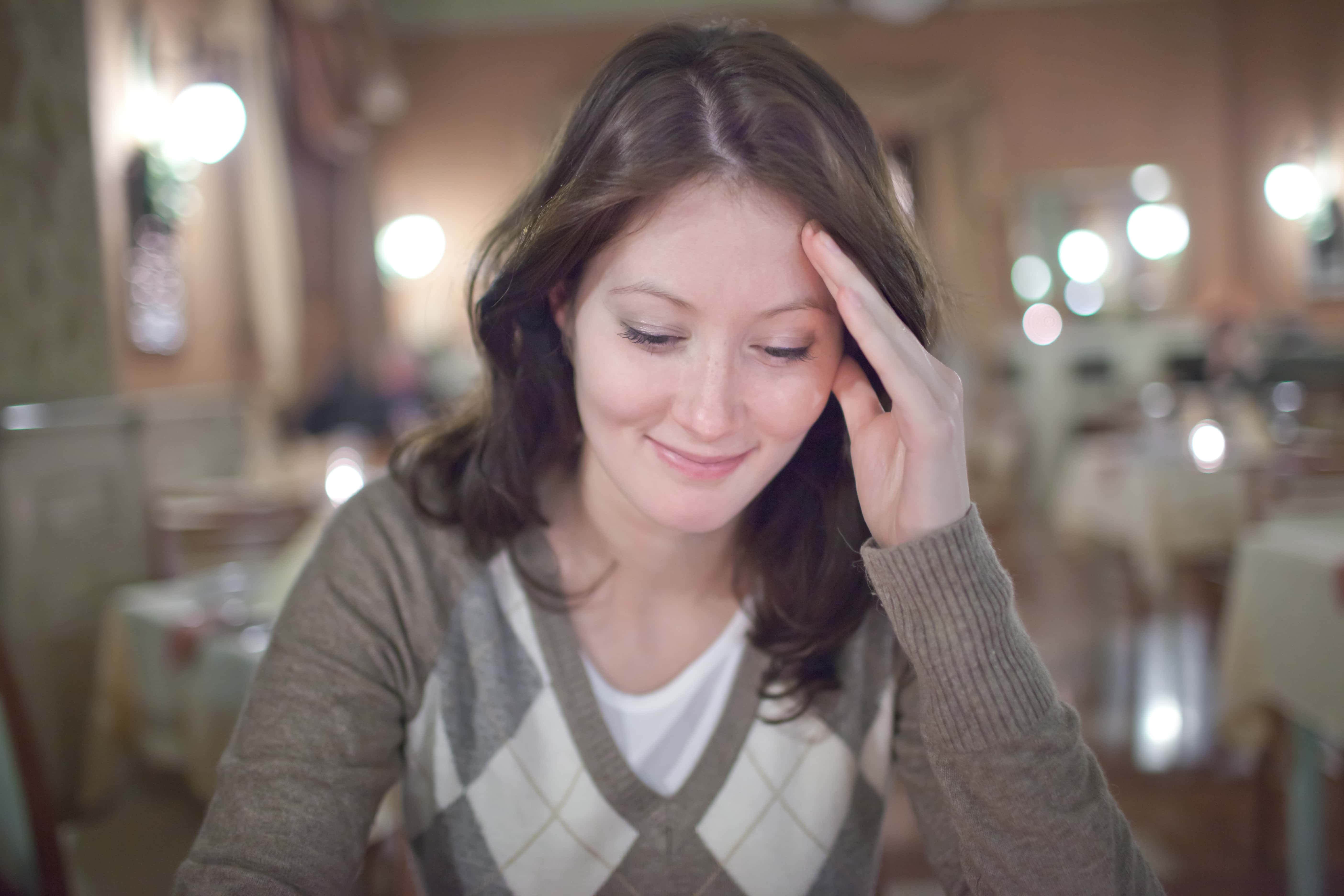 Young woman sitting in a restaurant