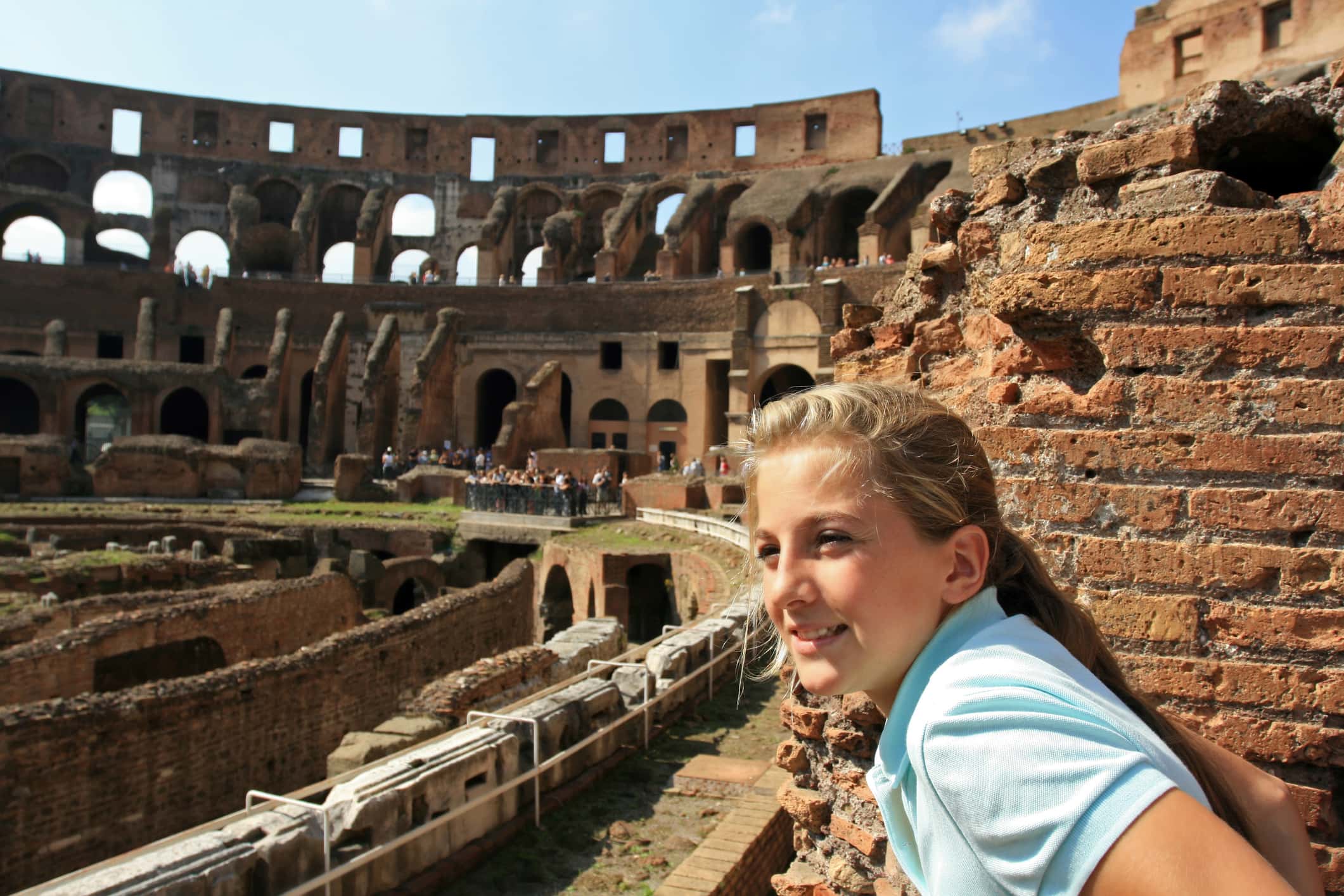 Young blond tourist in Colosseum, Rome Italy.