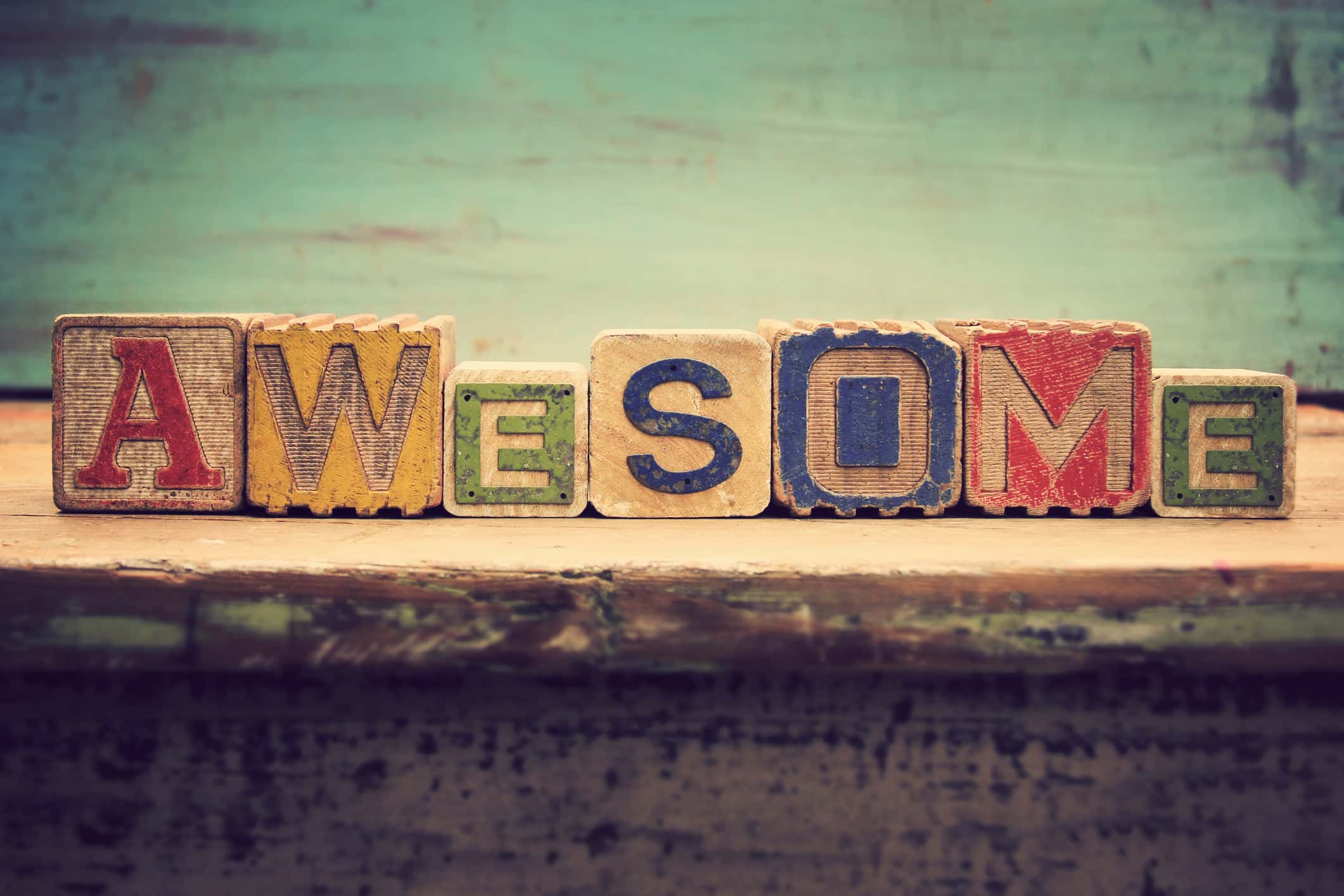 Old wooden alhpabet blocks that spell 'Awesome'.