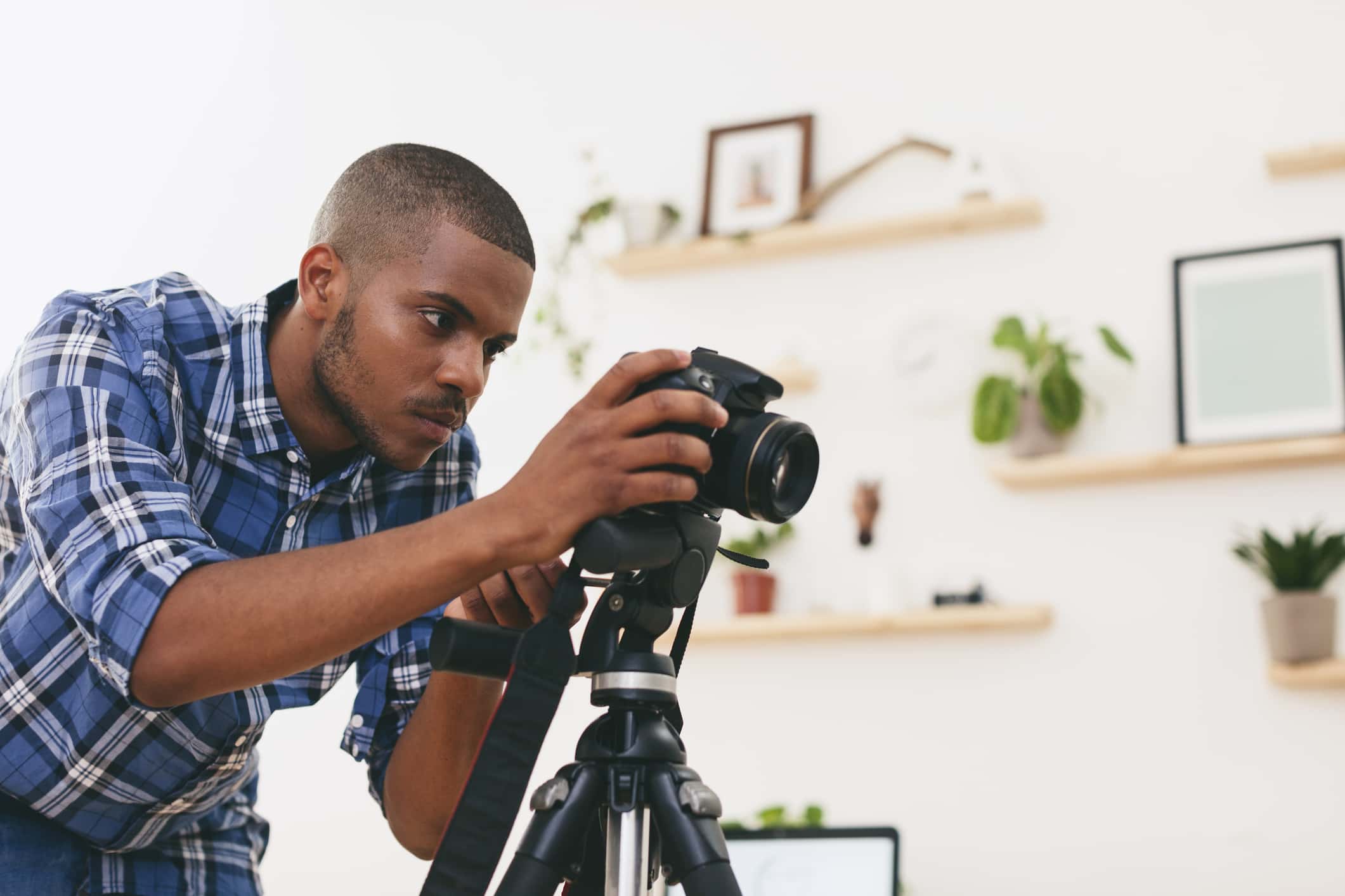 Young man at work in his photographic studio.
