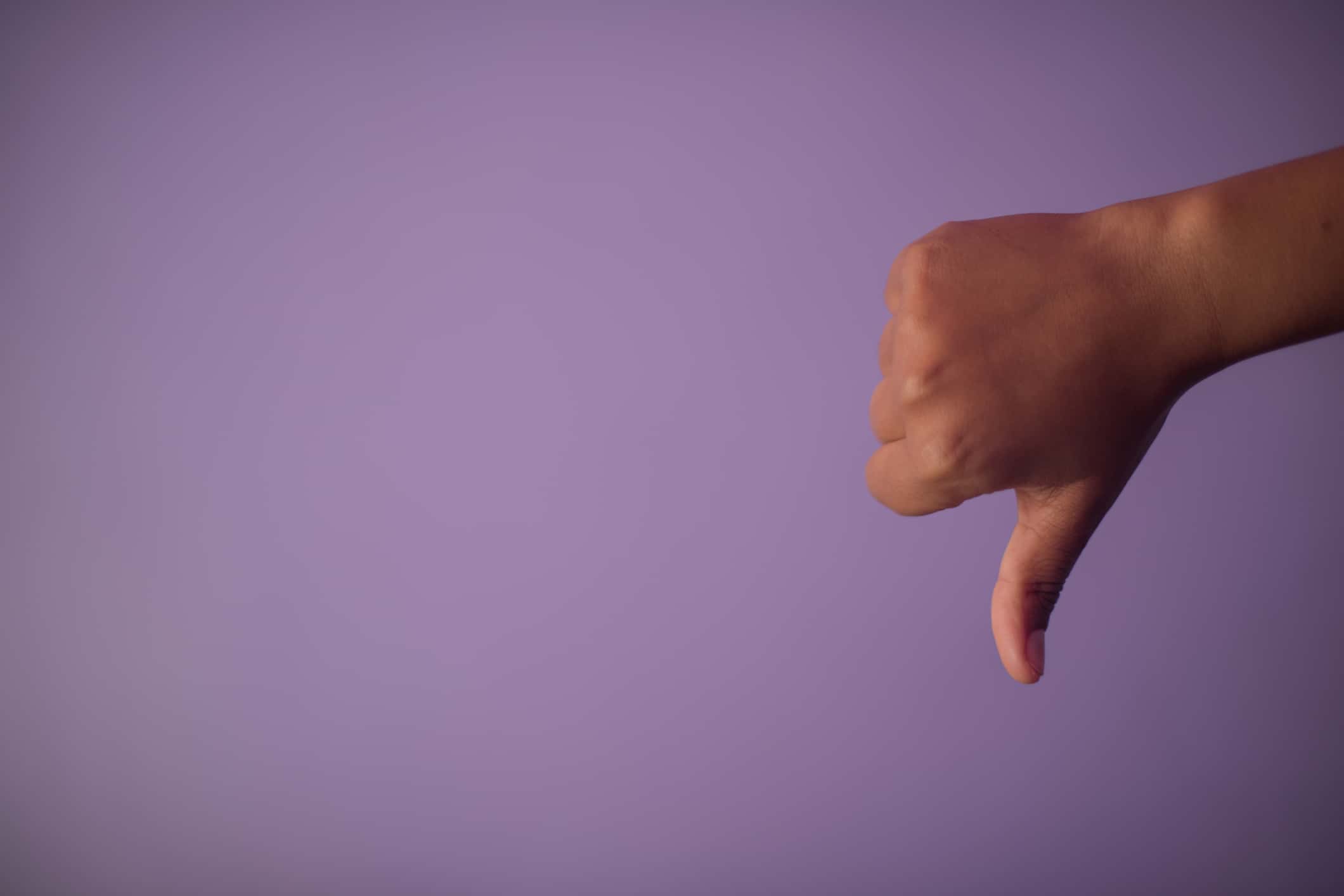 Close-Up Of Hand Giving Thumbs Down.