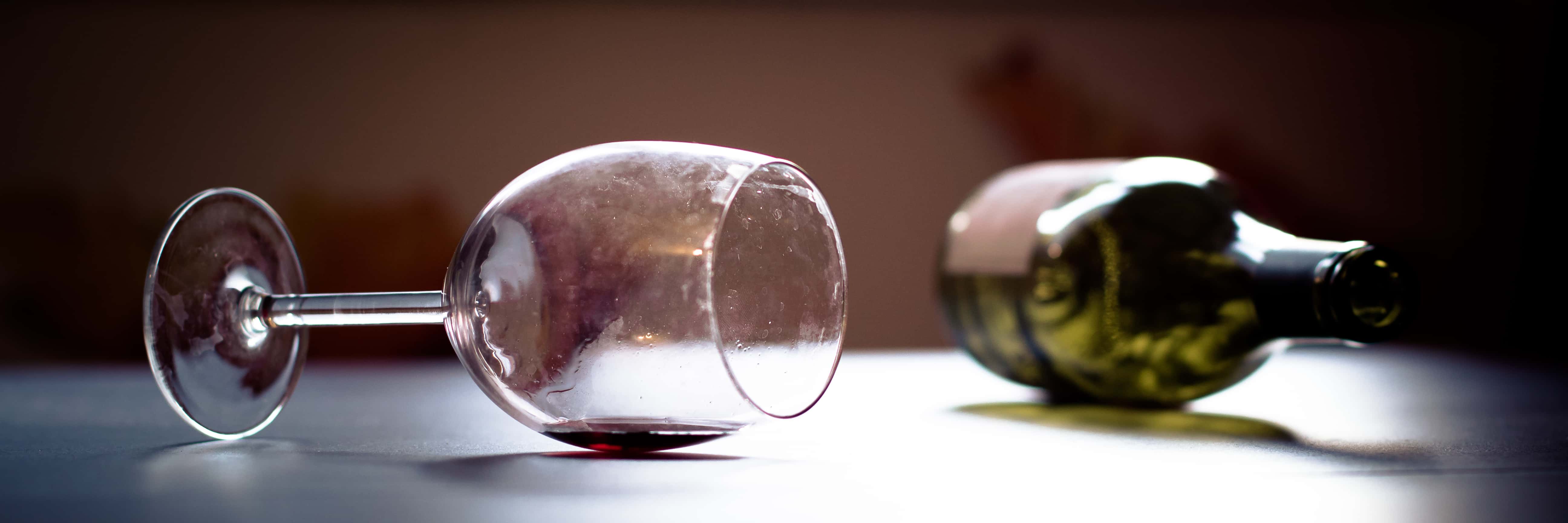 Empty wine bottle and wine glass