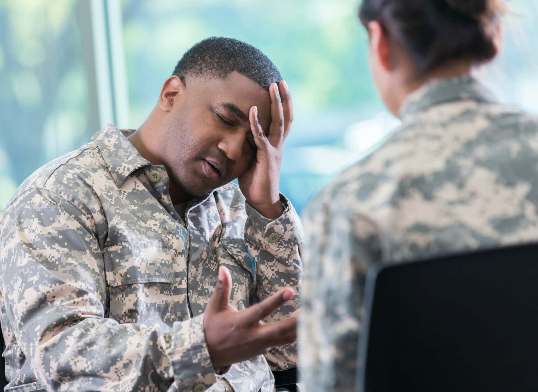Depressed soldier talks with counselor