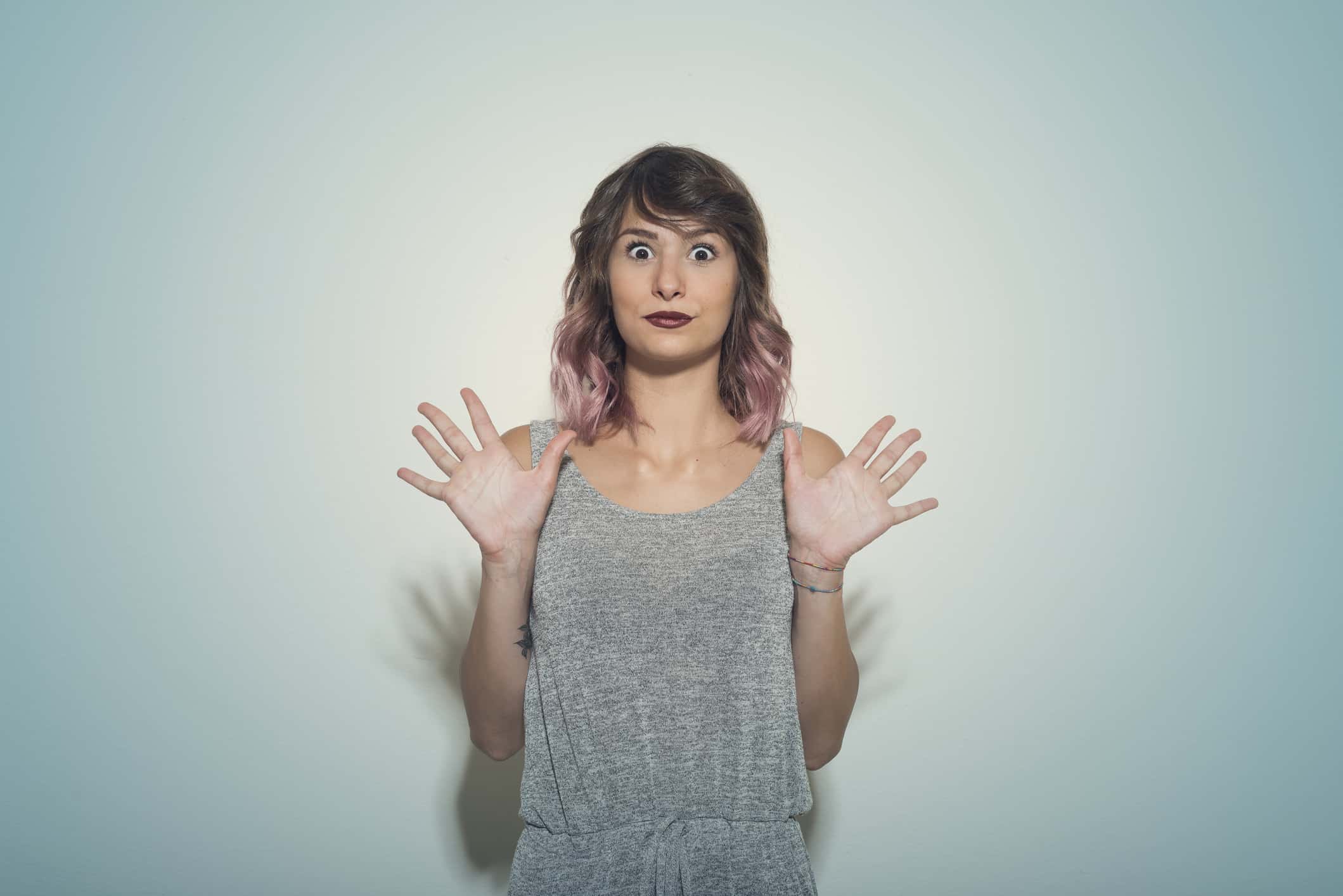 Attractive girl making mimic and facial expressions.