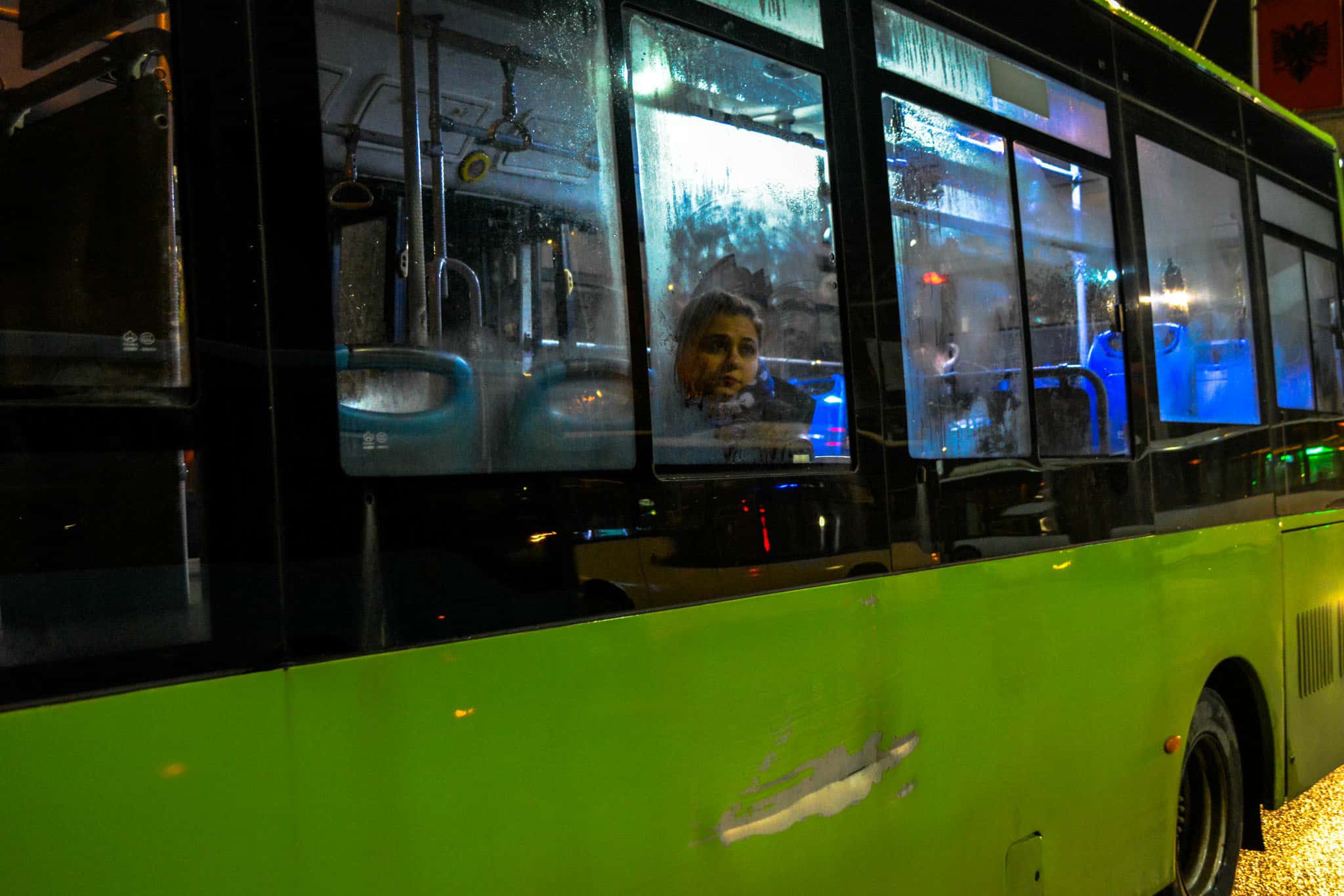 Thoughtful woman sitting in a bus.